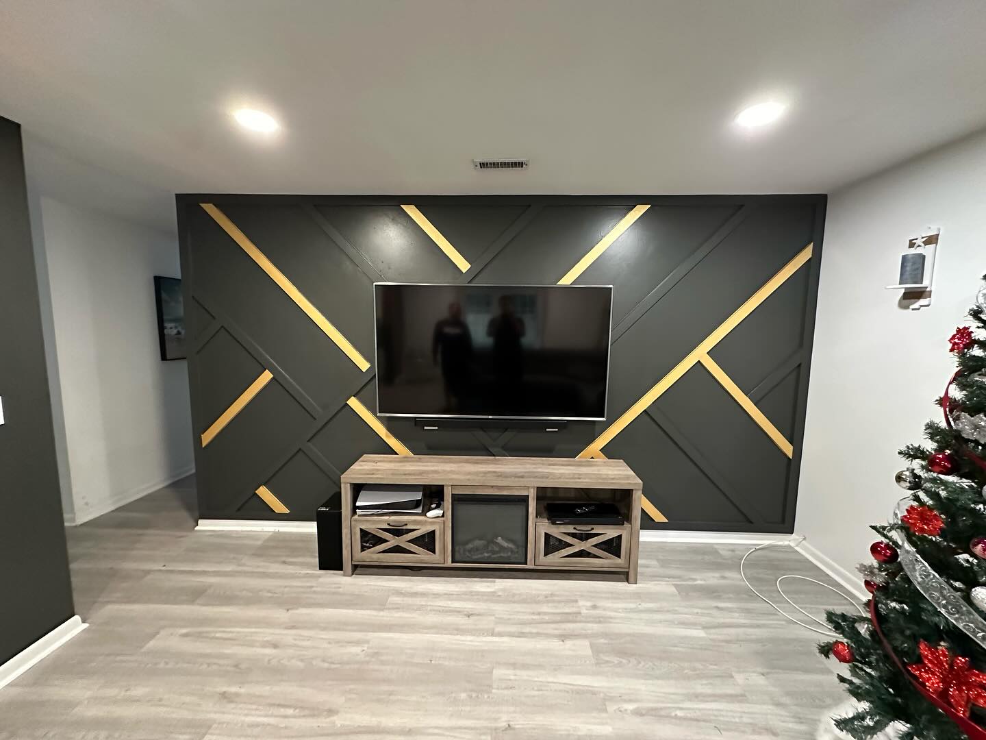 Slat-wall TV feature with hidden wiring by AVP Construction JAX — Jacksonville & St. John's County, FL