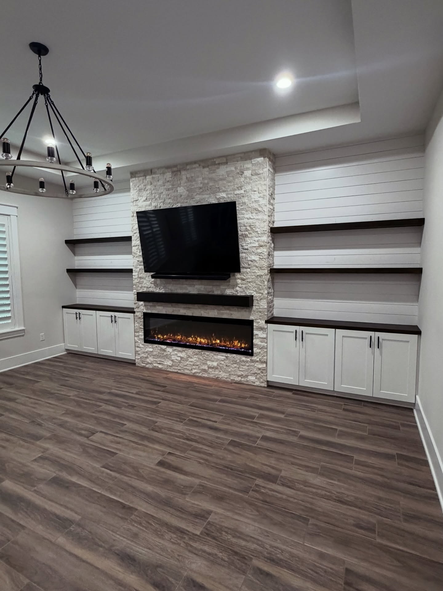 Floor-to-ceiling media wall with custom millwork by AVP Construction JAX — Jacksonville & St. John's County, FL