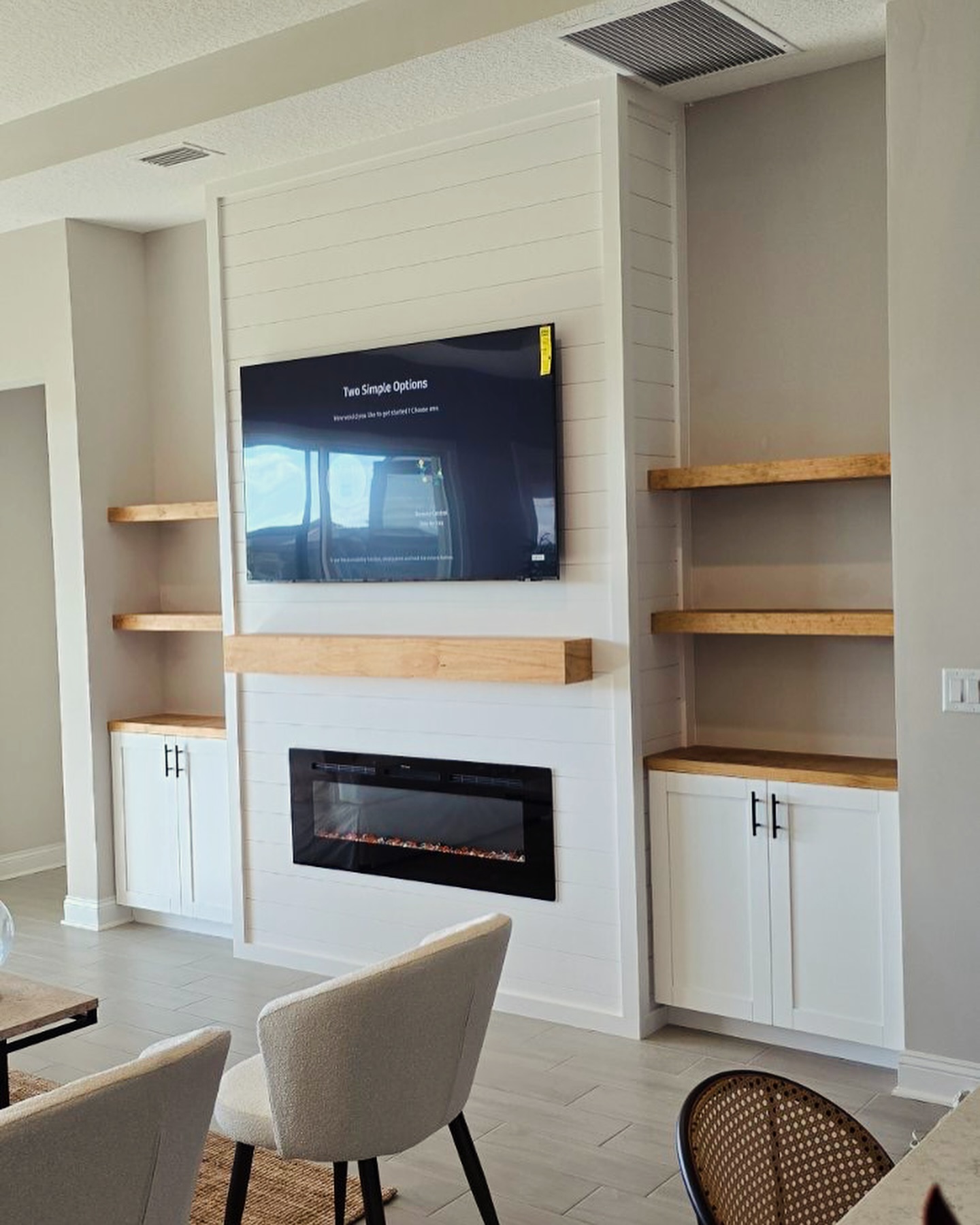 Floating-shelf TV built-in with shaker cabinets by AVP Construction JAX — Jacksonville & St. John's County, FL