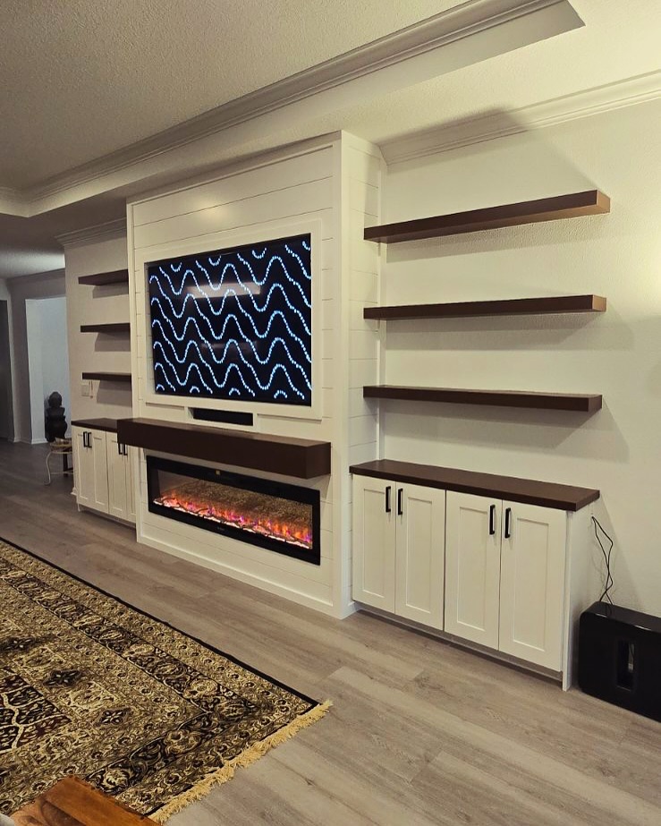 Wall-mounted TV with under-cabinet storage by AVP Construction JAX — Jacksonville & St. John's County, FL