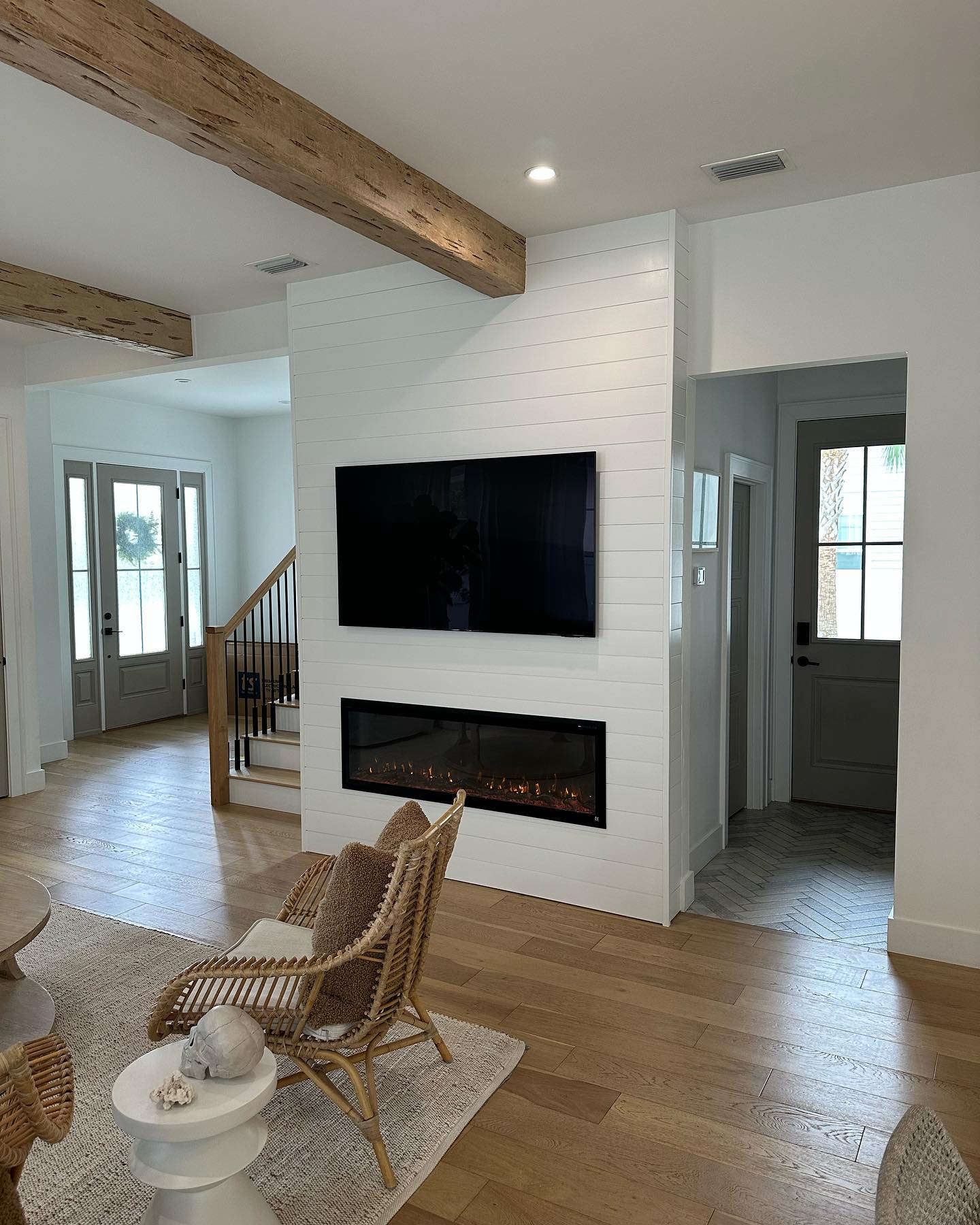 Modern entertainment center with electric fireplace by AVP Construction JAX — Jacksonville & St. John's County, FL