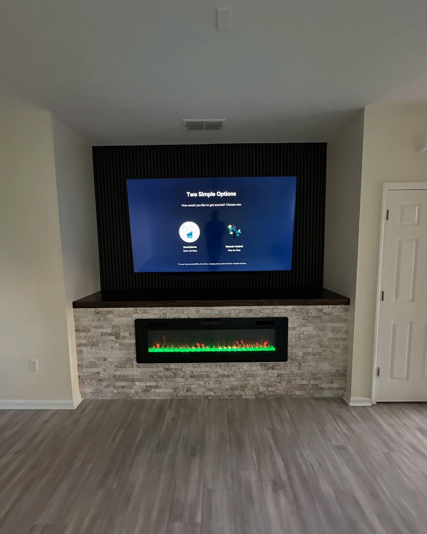 Slat-wall TV feature with hidden wiring by AVP Construction JAX — Jacksonville & St. John's County, FL