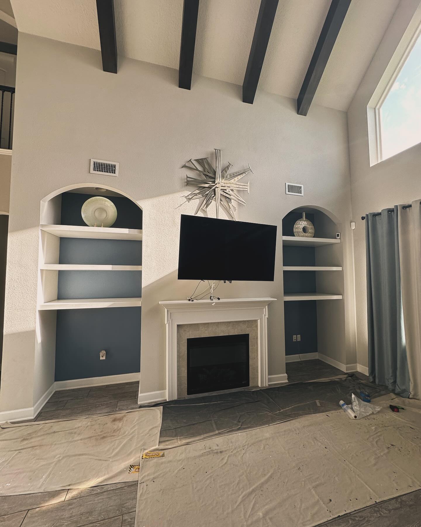 Floor-to-ceiling media wall with custom millwork by AVP Construction JAX — Jacksonville & St. John's County, FL