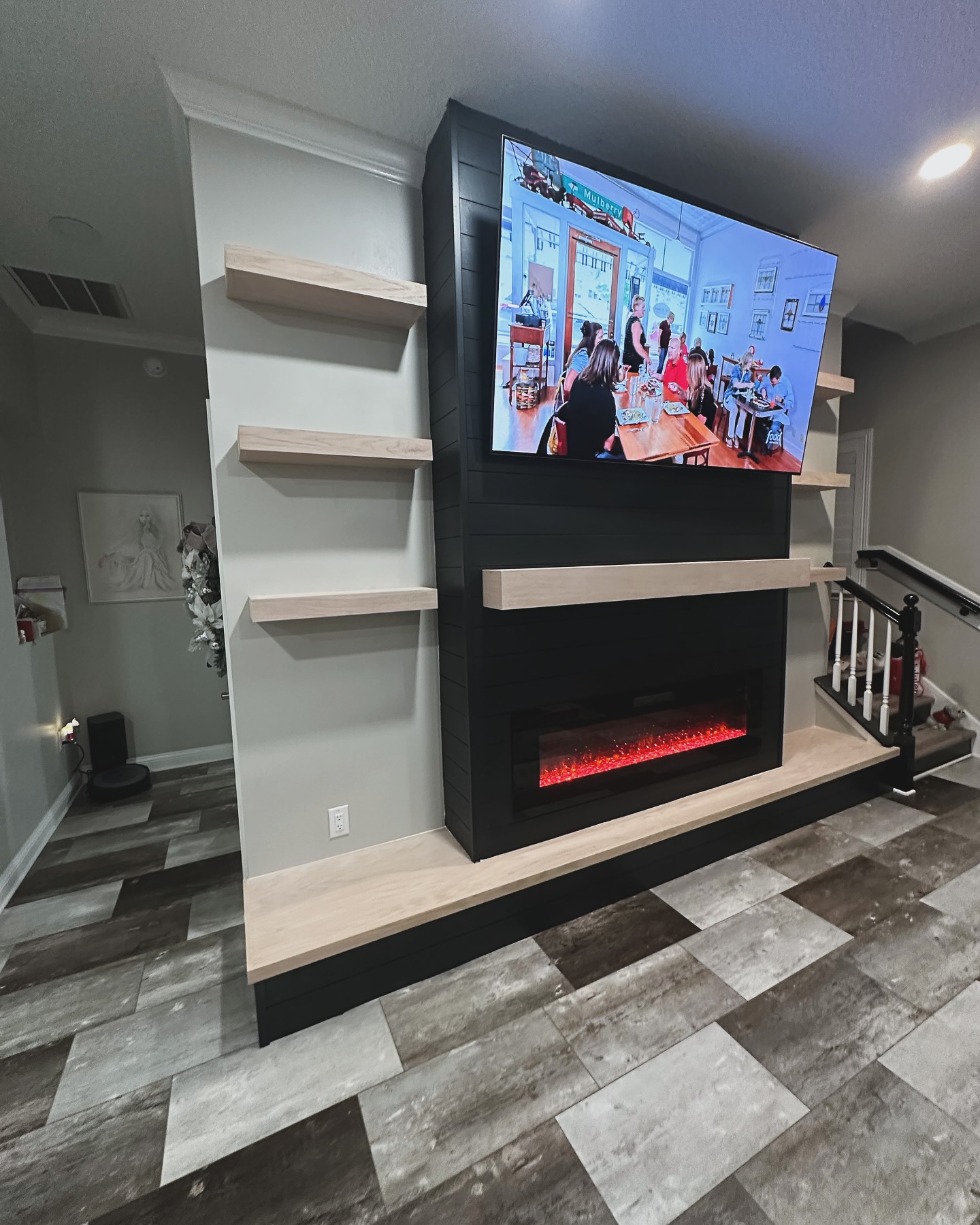 Wall-mounted TV with under-cabinet storage by AVP Construction JAX — Jacksonville & St. John's County, FL