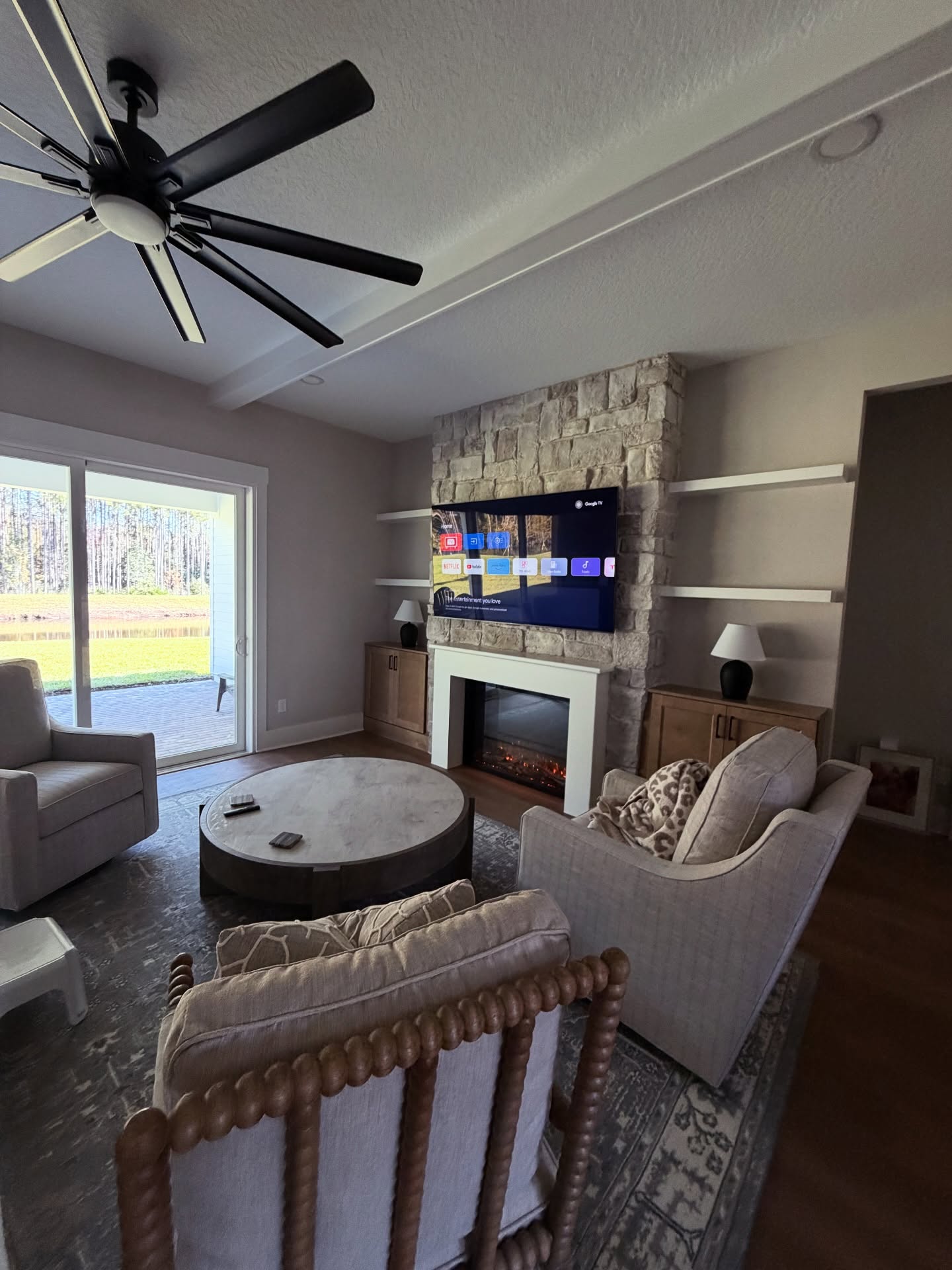 Modern entertainment center with electric fireplace by AVP Construction JAX — Jacksonville & St. John's County, FL