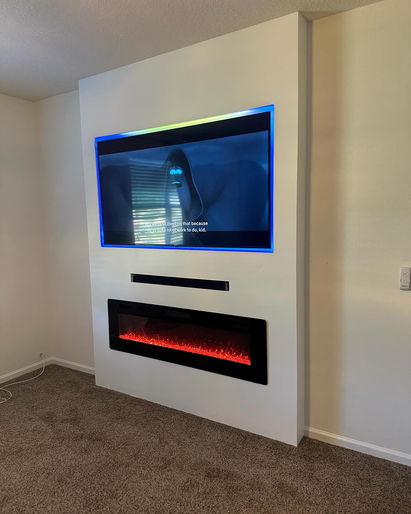 Custom living-room media wall with paneling by AVP Construction JAX — Jacksonville & St. John's County, FL