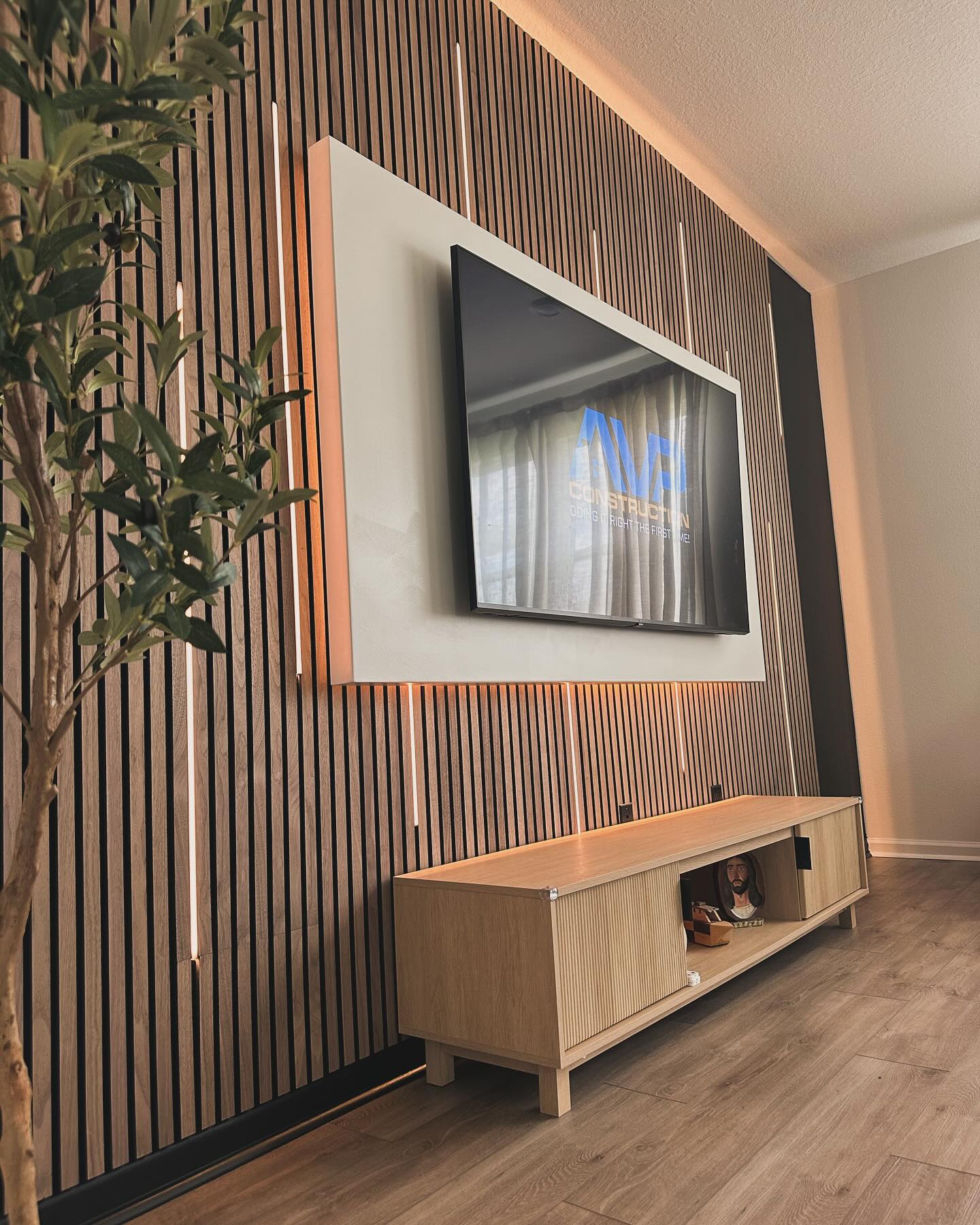 Floor-to-ceiling media wall with custom millwork by AVP Construction JAX — Jacksonville & St. John's County, FL