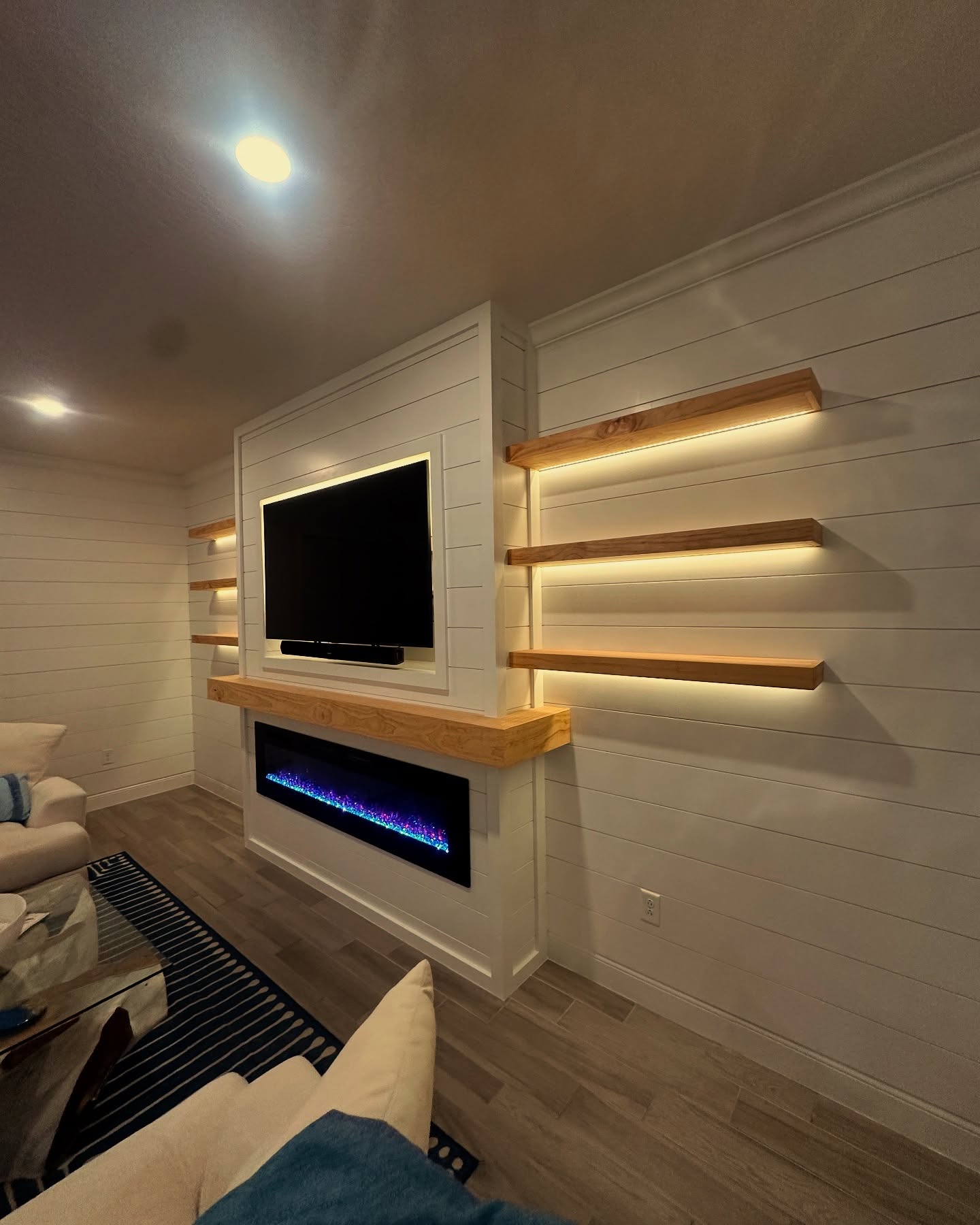 Wall-mounted TV with under-cabinet storage by AVP Construction JAX — Jacksonville & St. John's County, FL