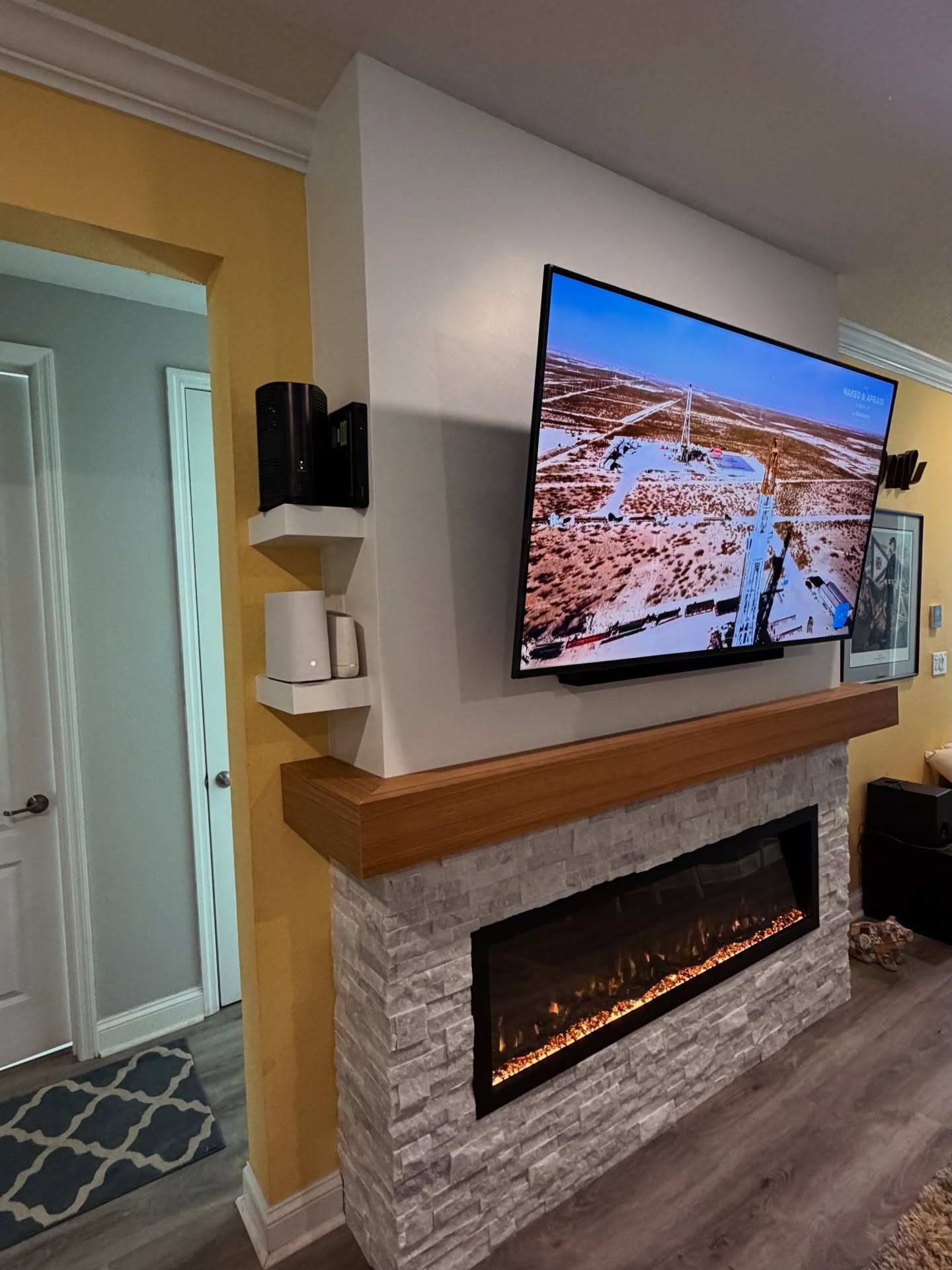 Built-in TV cabinet flanked by display shelving by AVP Construction JAX — Jacksonville & St. John's County, FL