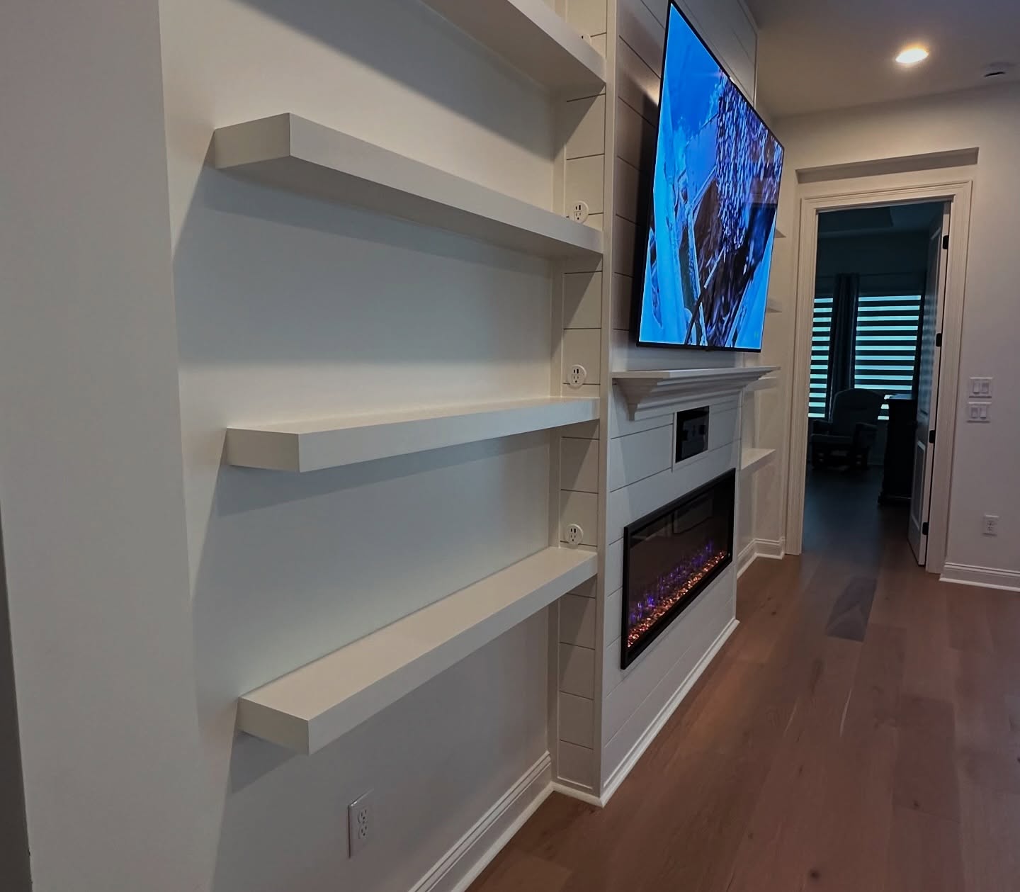Slat-wall TV feature with hidden wiring by AVP Construction JAX — Jacksonville & St. John's County, FL