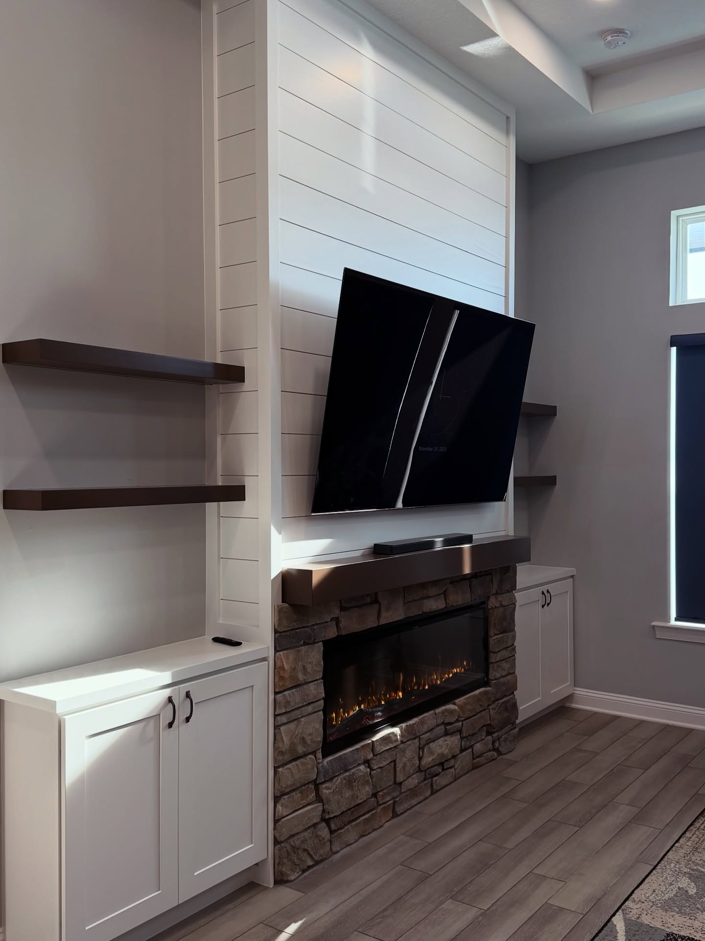 Built-in TV cabinet flanked by display shelving by AVP Construction JAX — Jacksonville & St. John's County, FL