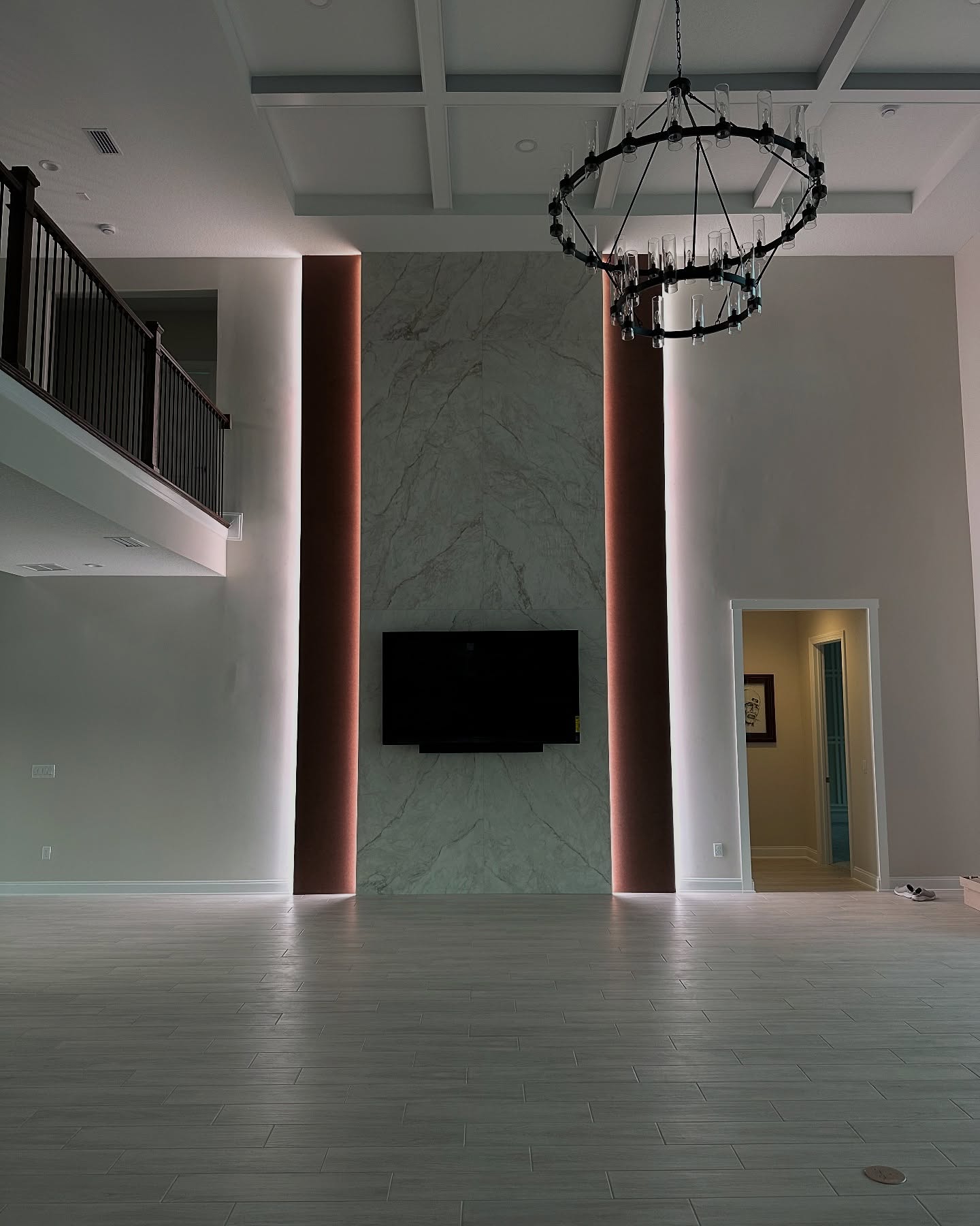 Custom living-room media wall with paneling by AVP Construction JAX — Jacksonville & St. John's County, FL