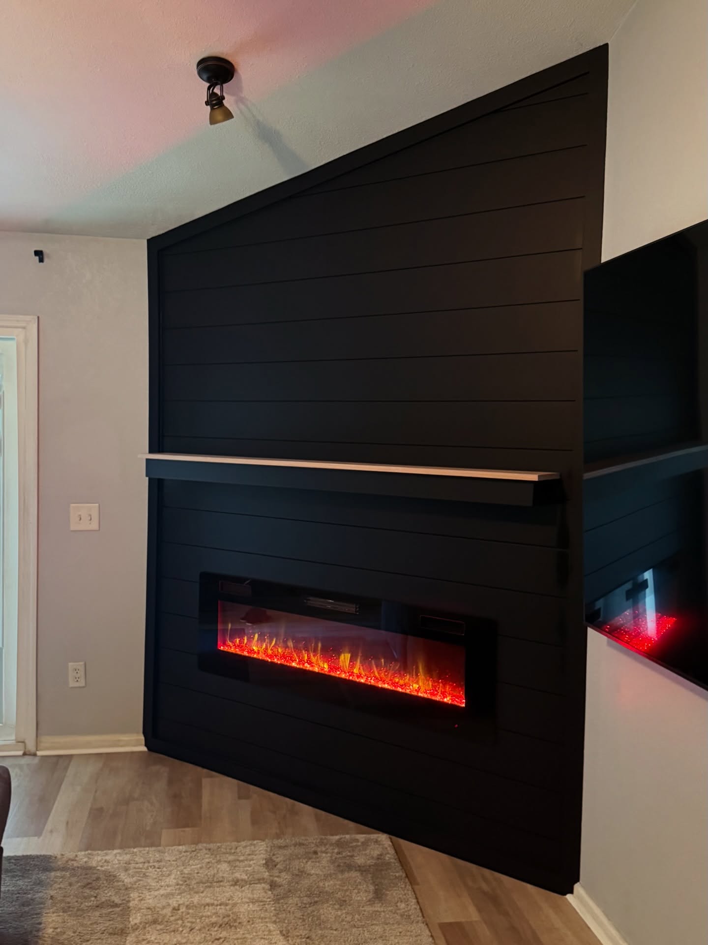 Slat-wall TV feature with hidden wiring by AVP Construction JAX — Jacksonville & St. John's County, FL