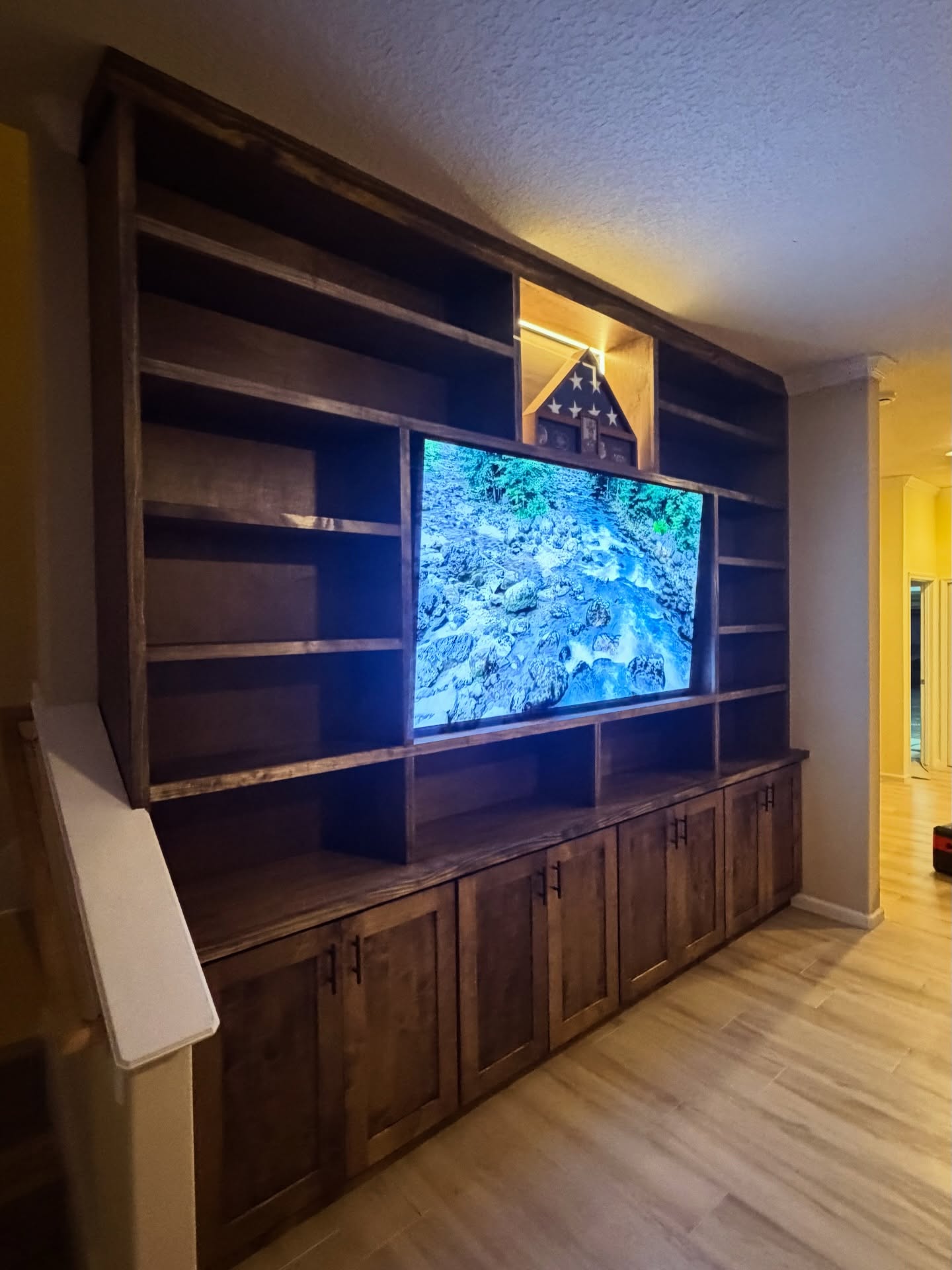 Floor-to-ceiling media wall with custom millwork by AVP Construction JAX — Jacksonville & St. John's County, FL