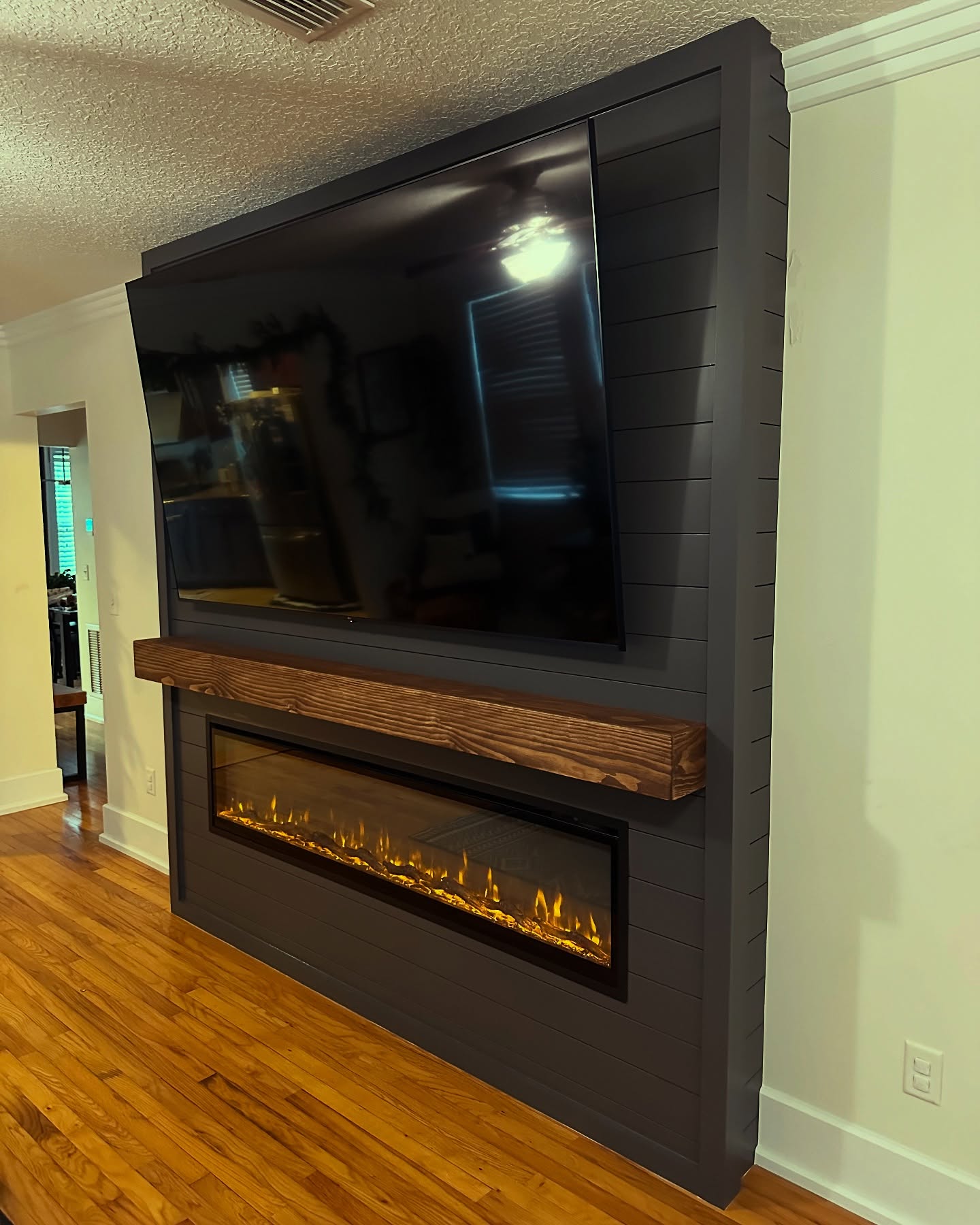 Built-in TV cabinet flanked by display shelving by AVP Construction JAX — Jacksonville & St. John's County, FL