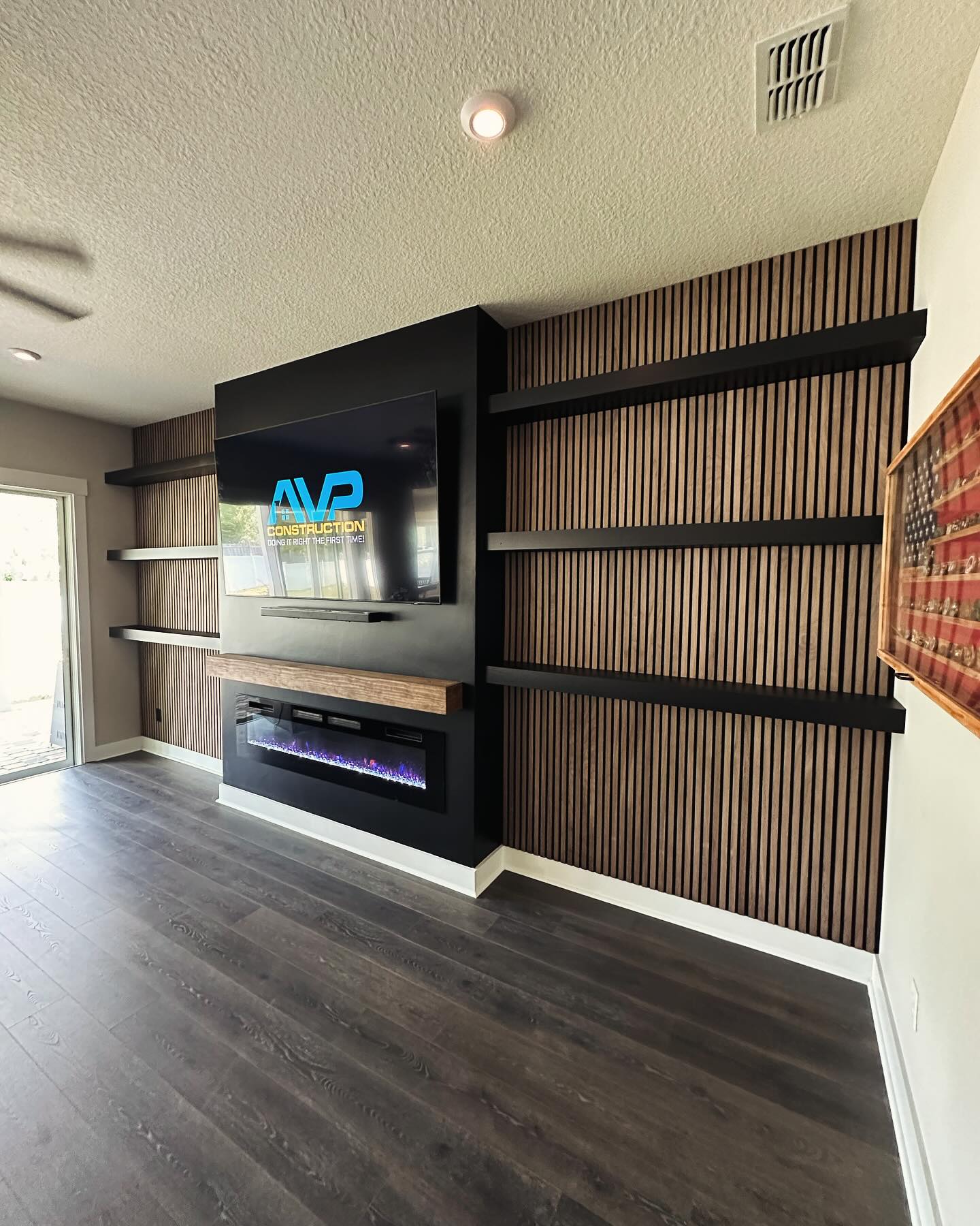 Custom TV entertainment center built-in by AVP Construction JAX — Jacksonville & St. John's County, FL