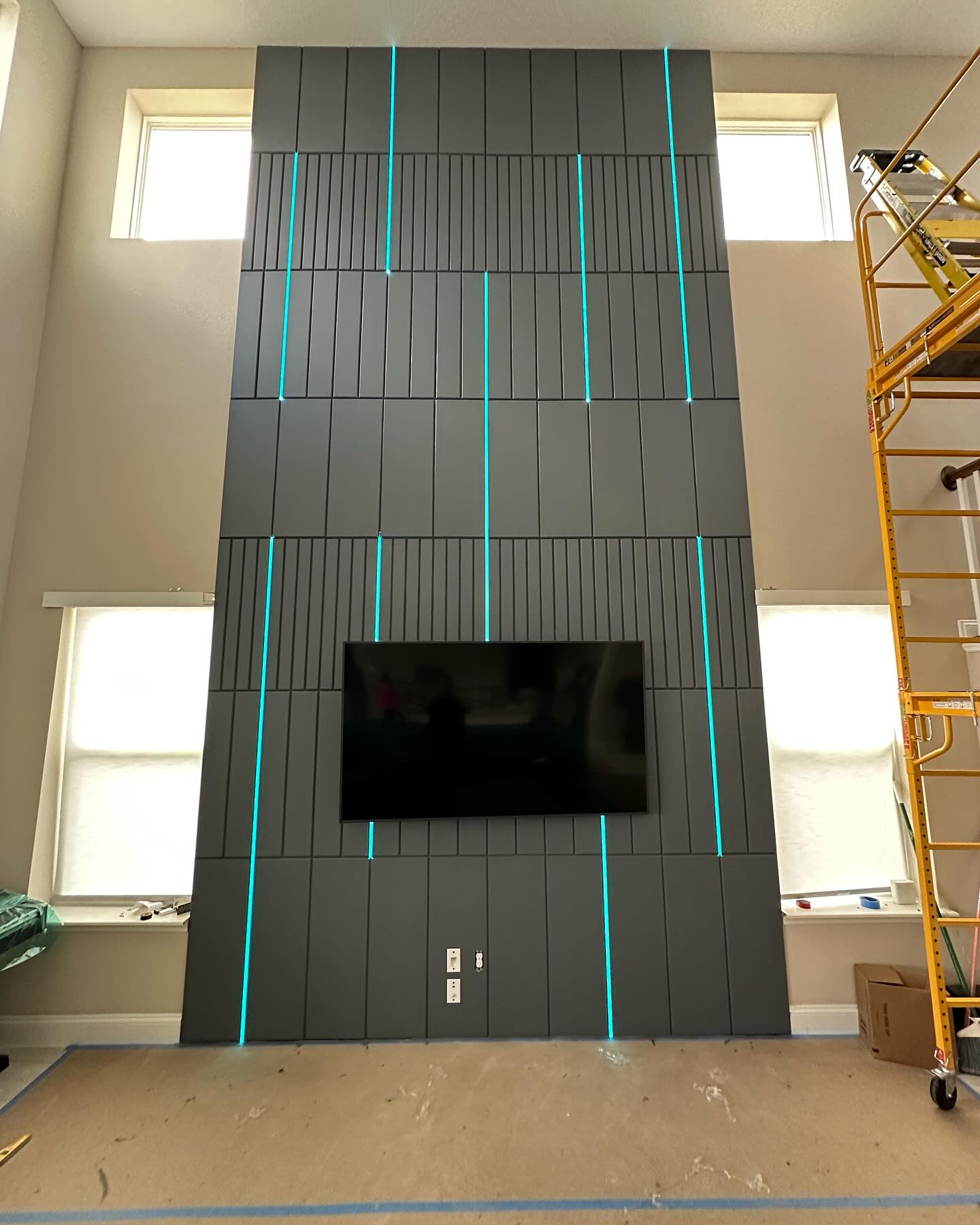 Floor-to-ceiling media wall with custom millwork by AVP Construction JAX — Jacksonville & St. John's County, FL