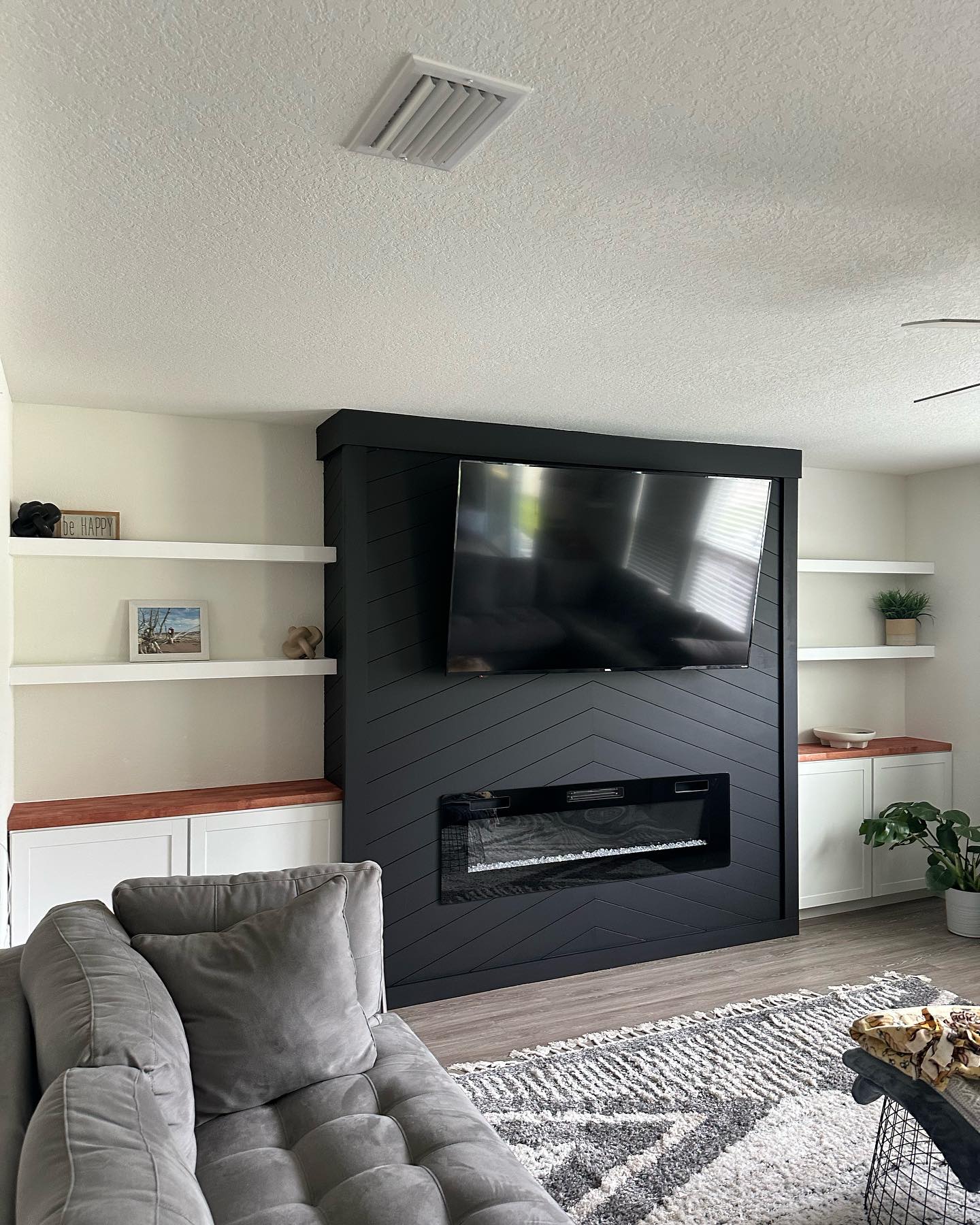 Floating-shelf TV built-in with shaker cabinets by AVP Construction JAX — Jacksonville & St. John's County, FL