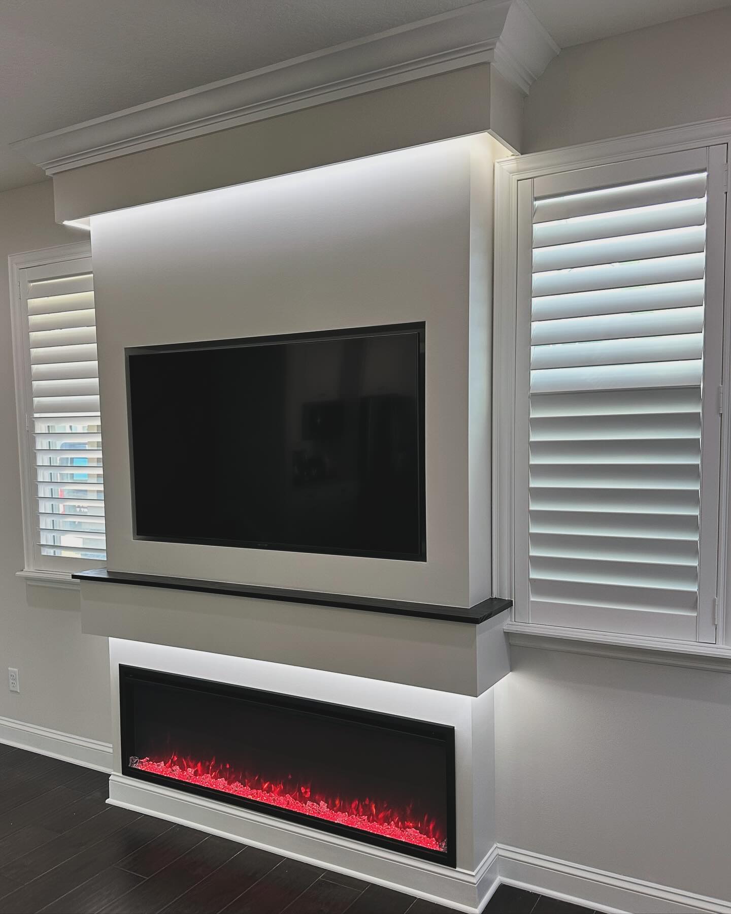 Custom living-room media wall with paneling by AVP Construction JAX — Jacksonville & St. John's County, FL