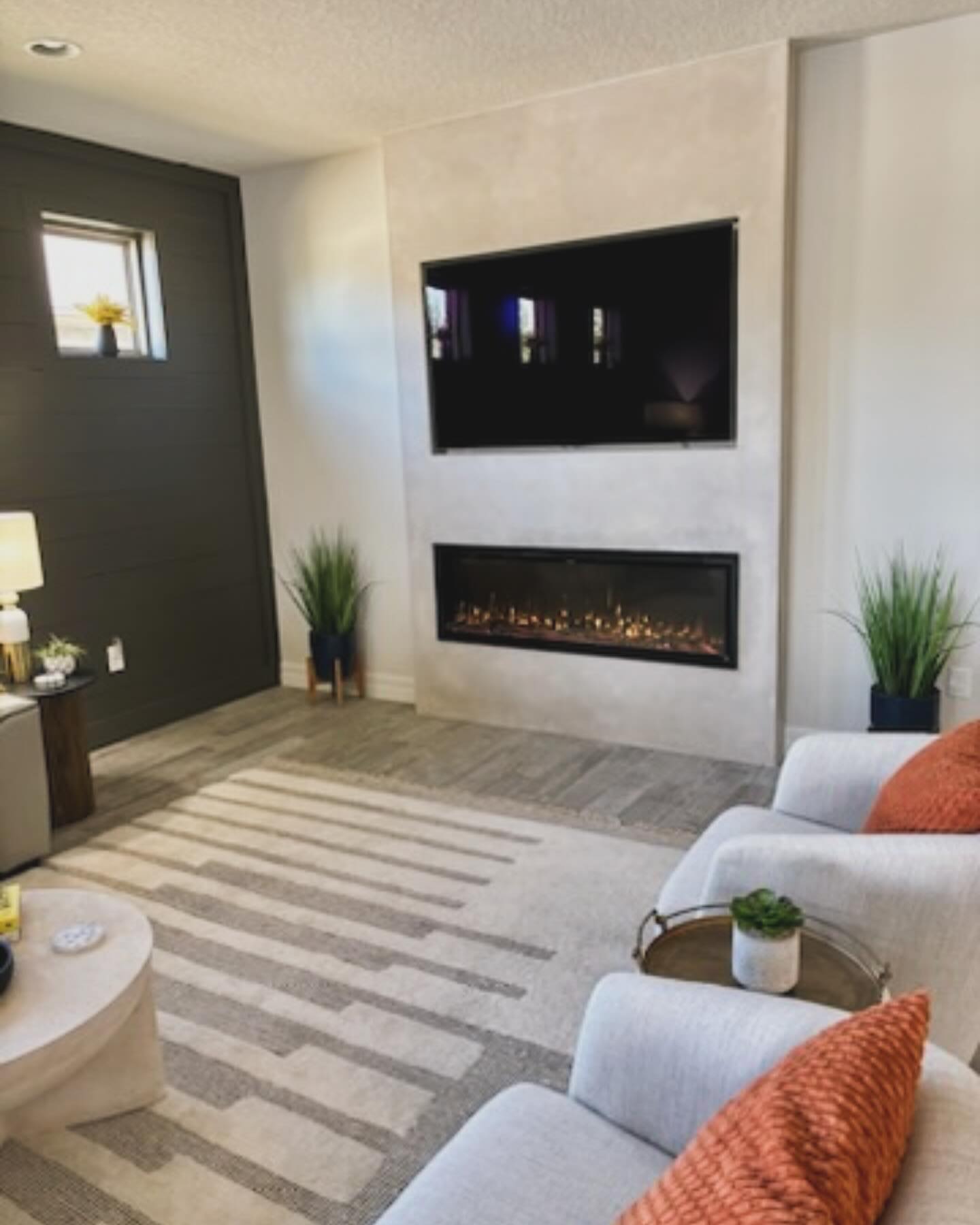 Floor-to-ceiling media wall with custom millwork by AVP Construction JAX — Jacksonville & St. John's County, FL