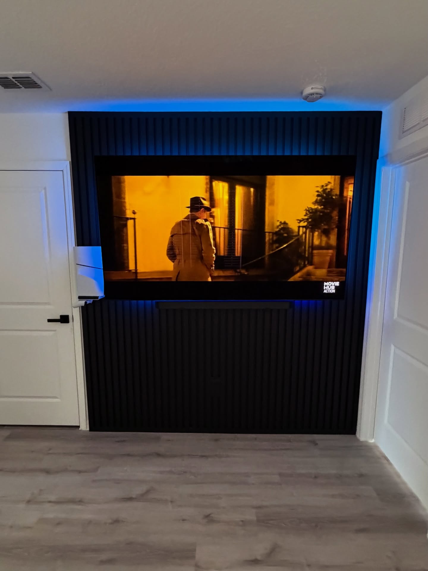 Floating-shelf TV built-in with shaker cabinets by AVP Construction JAX — Jacksonville & St. John's County, FL
