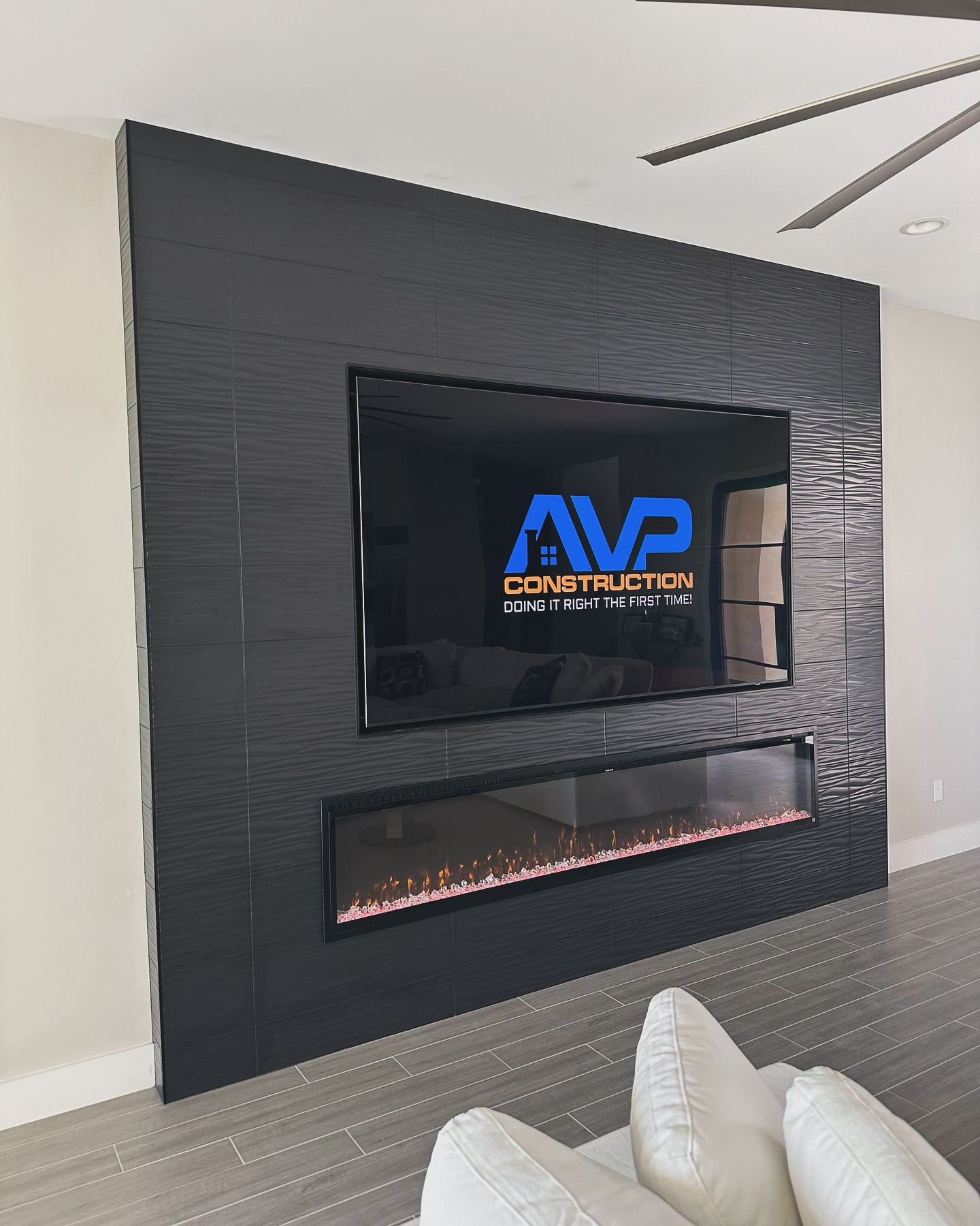 Built-in TV cabinet flanked by display shelving by AVP Construction JAX — Jacksonville & St. John's County, FL