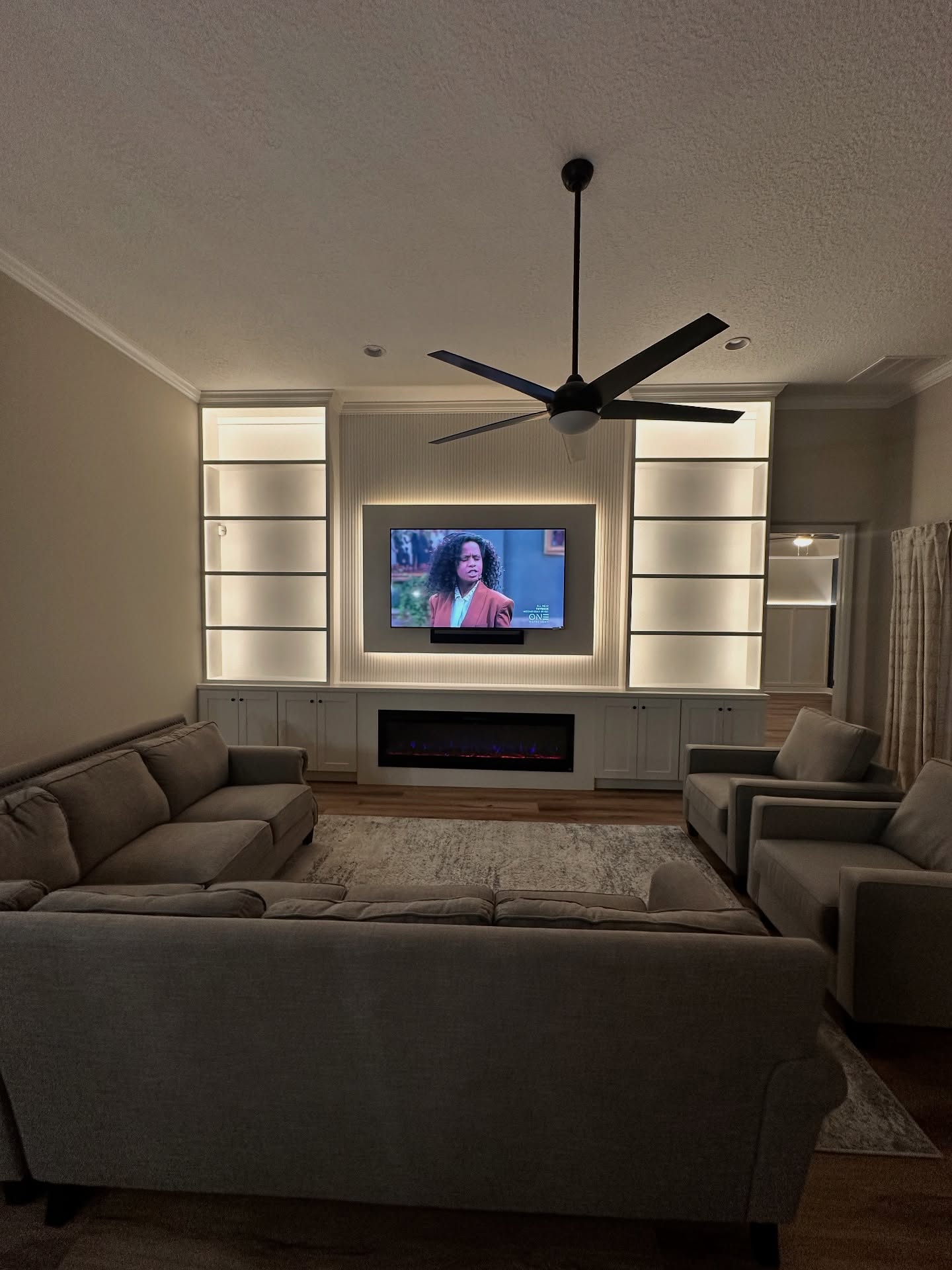 Floor-to-ceiling media wall with custom millwork by AVP Construction JAX — Jacksonville & St. John's County, FL