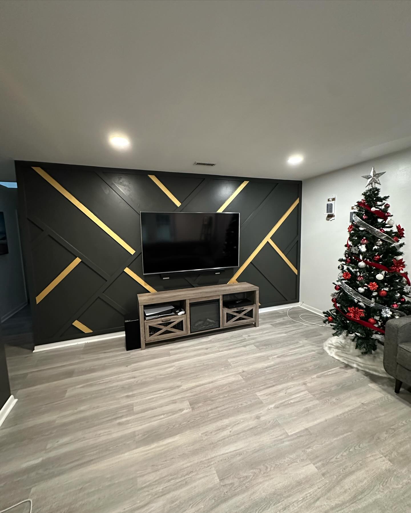 Wall-mounted TV with under-cabinet storage by AVP Construction JAX — Jacksonville & St. John's County, FL