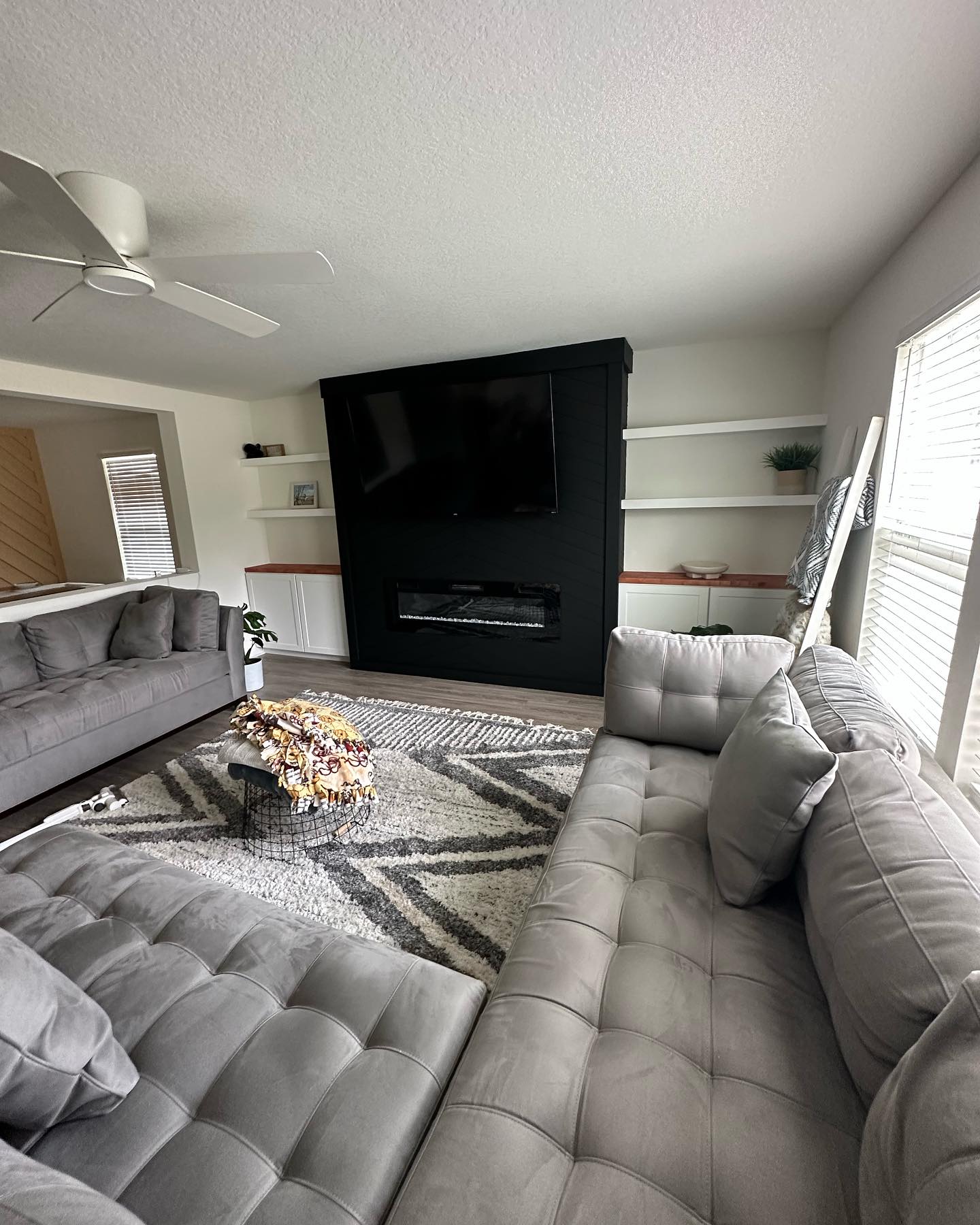 Built-in TV cabinet flanked by display shelving by AVP Construction JAX — Jacksonville & St. John's County, FL