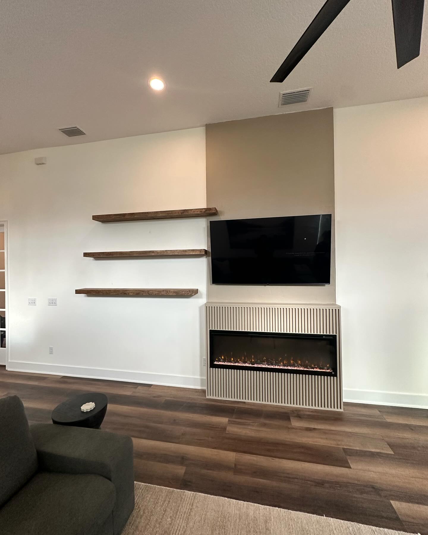 Custom living-room media wall with paneling by AVP Construction JAX — Jacksonville & St. John's County, FL