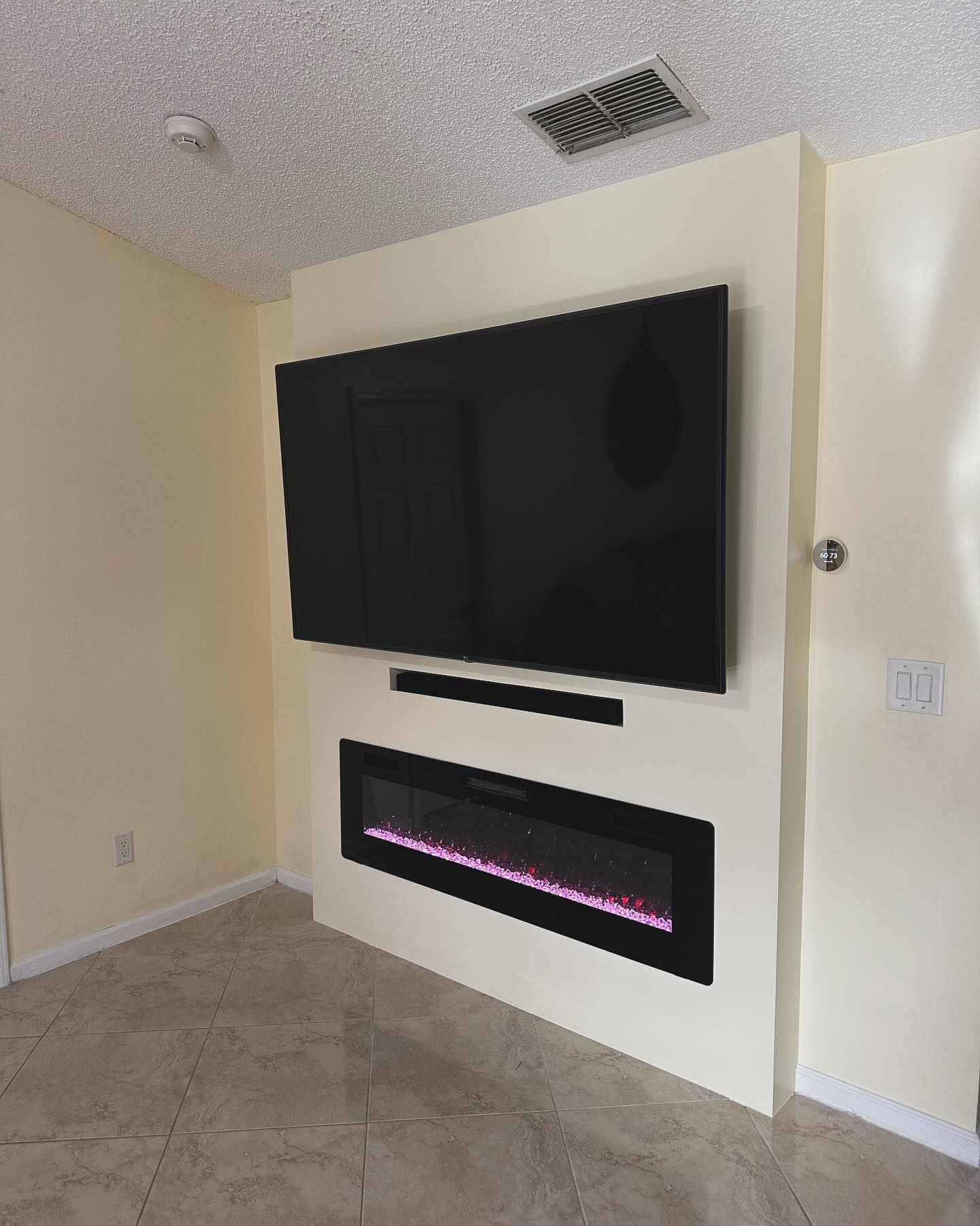Slat-wall TV feature with hidden wiring by AVP Construction JAX — Jacksonville & St. John's County, FL