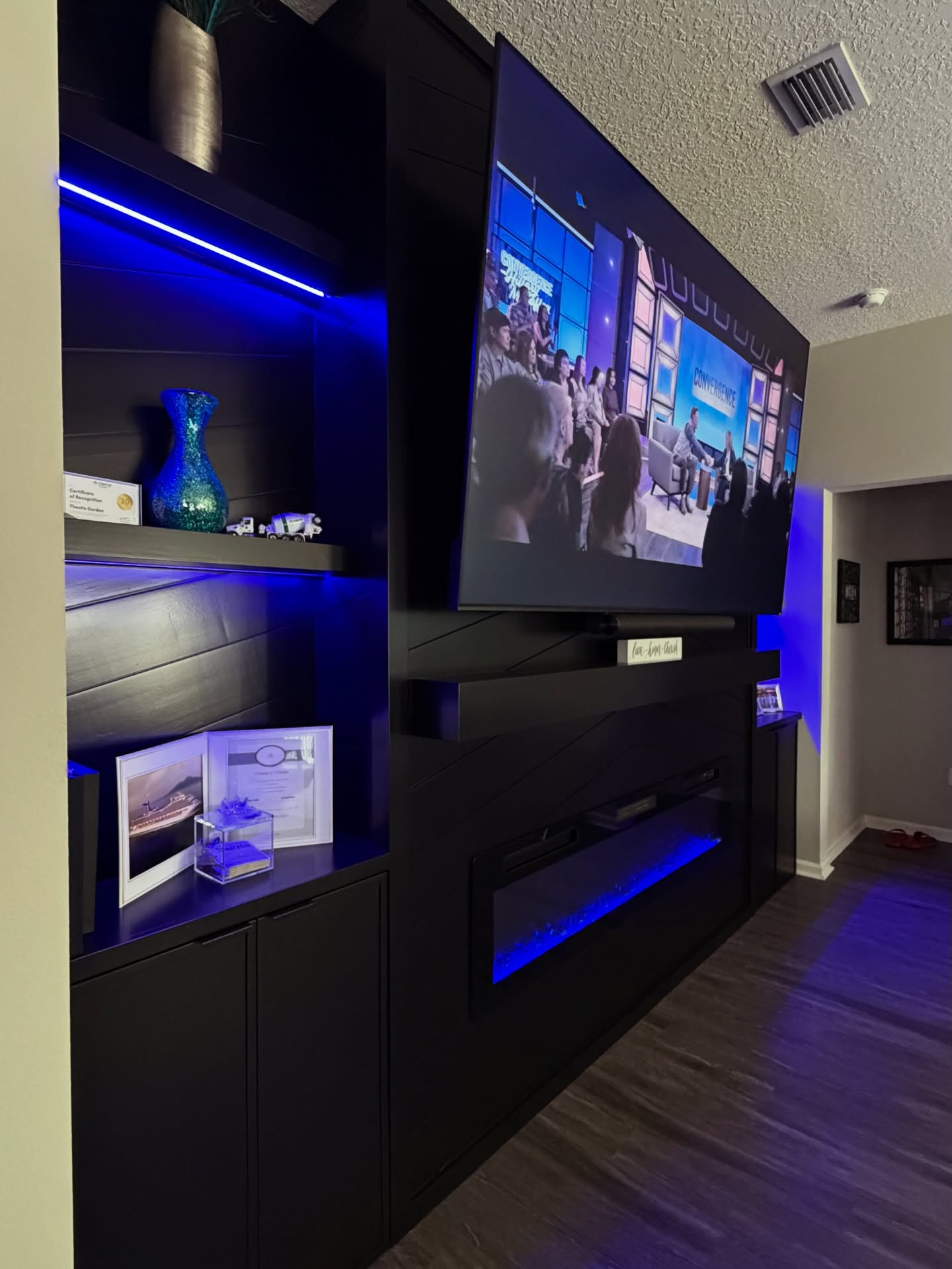 Floor-to-ceiling media wall with custom millwork by AVP Construction JAX — Jacksonville & St. John's County, FL