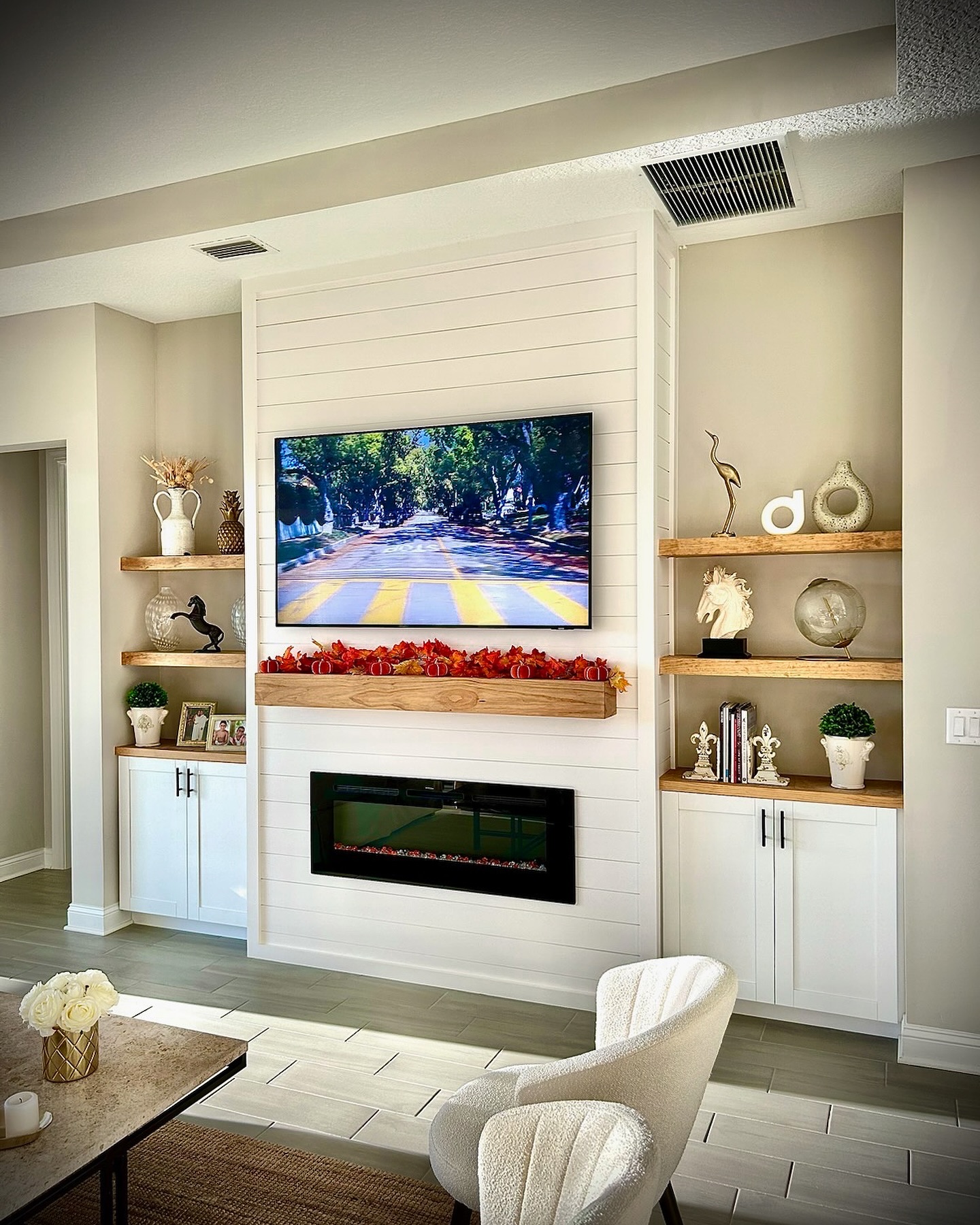 Floating-shelf TV built-in with shaker cabinets by AVP Construction JAX — Jacksonville & St. John's County, FL