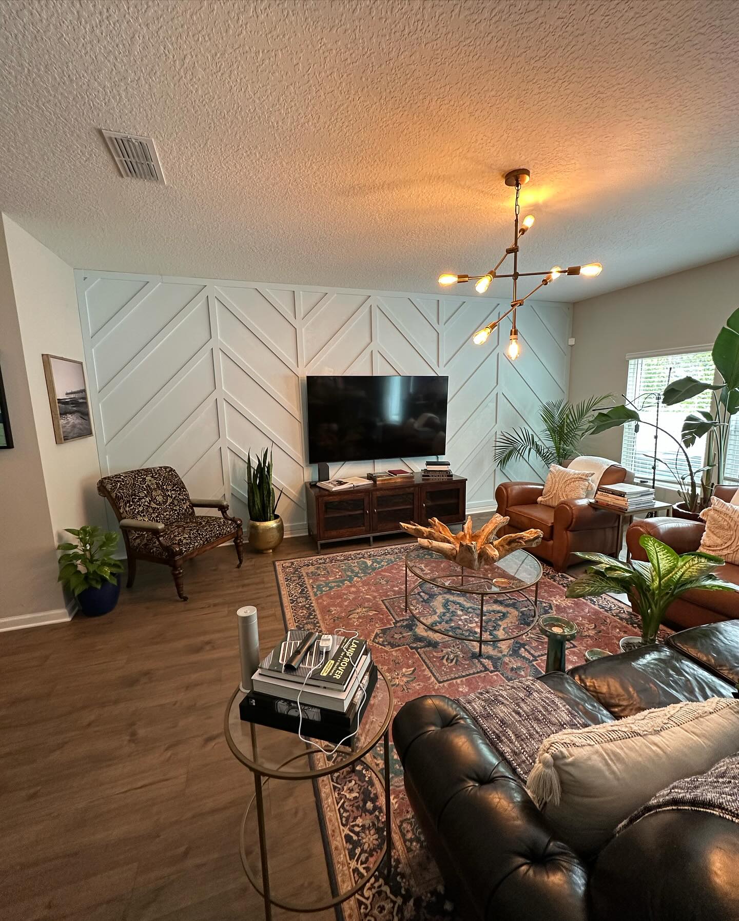 Modern entertainment center with electric fireplace by AVP Construction JAX — Jacksonville & St. John's County, FL