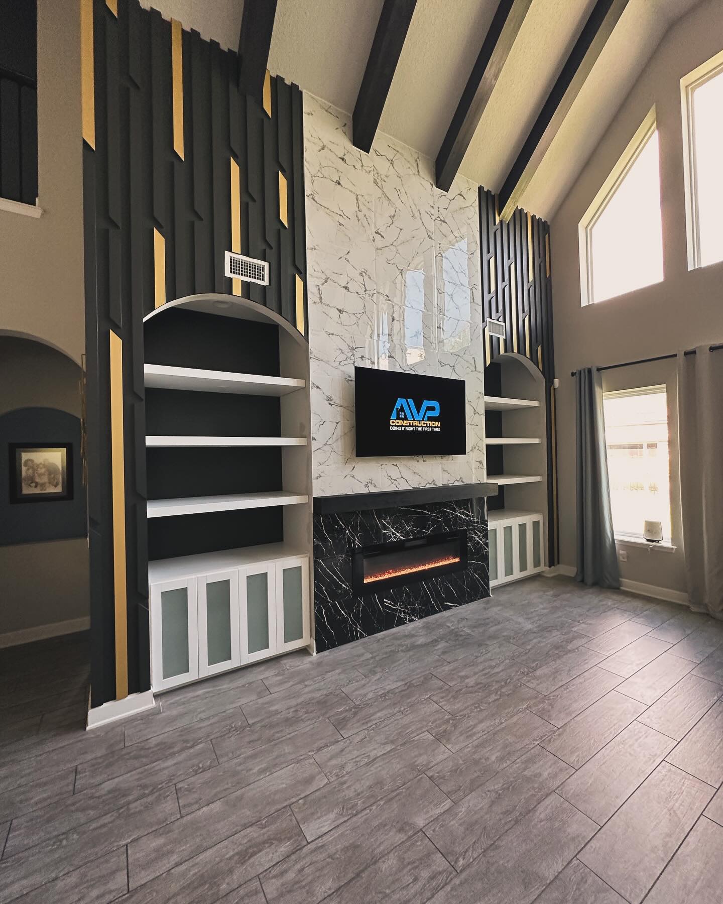 Slat-wall TV feature with hidden wiring by AVP Construction JAX — Jacksonville & St. John's County, FL