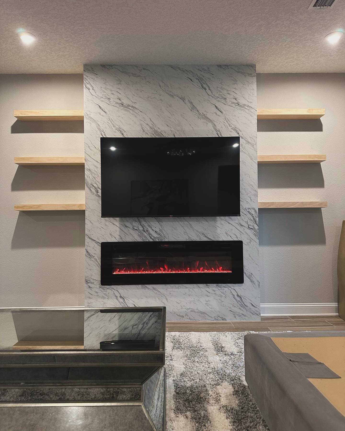 Floor-to-ceiling media wall with custom millwork by AVP Construction JAX — Jacksonville & St. John's County, FL