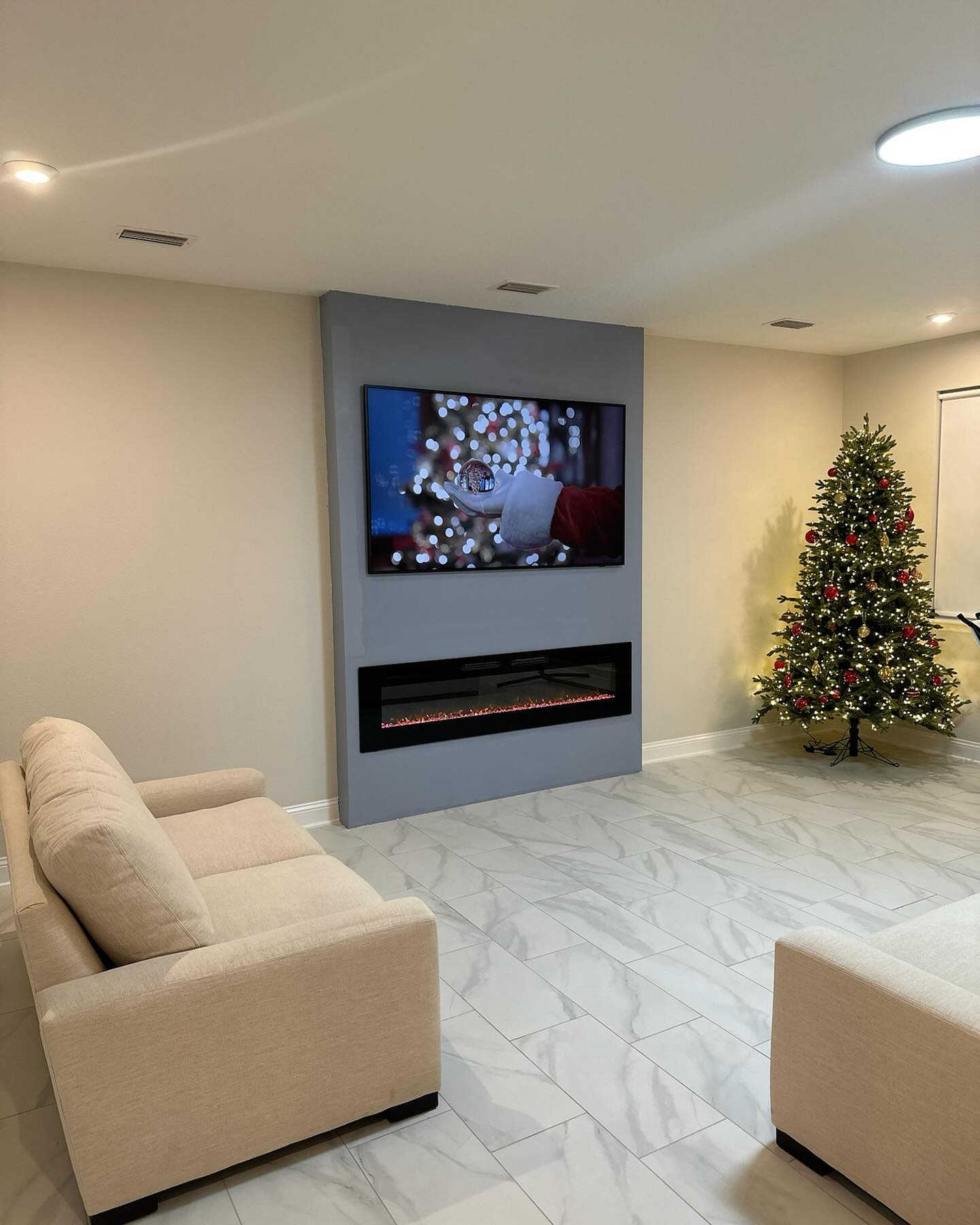 Floating-shelf TV built-in with shaker cabinets by AVP Construction JAX — Jacksonville & St. John's County, FL