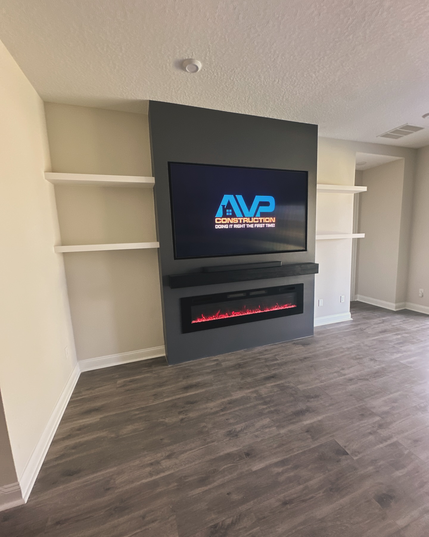 Custom TV entertainment center built-in by AVP Construction JAX — Jacksonville & St. John's County, FL