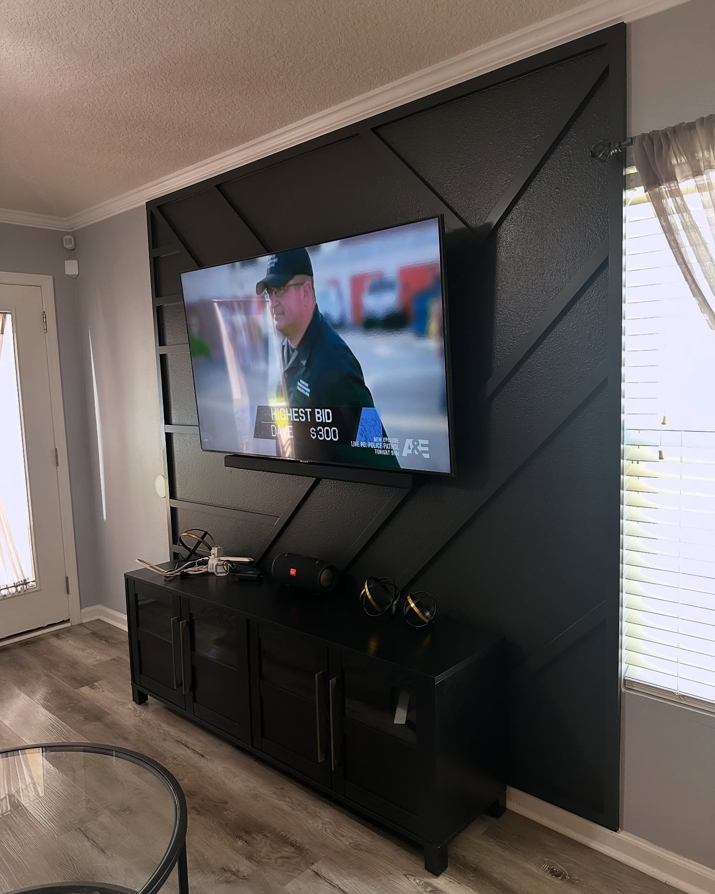 Floor-to-ceiling media wall with custom millwork by AVP Construction JAX — Jacksonville & St. John's County, FL