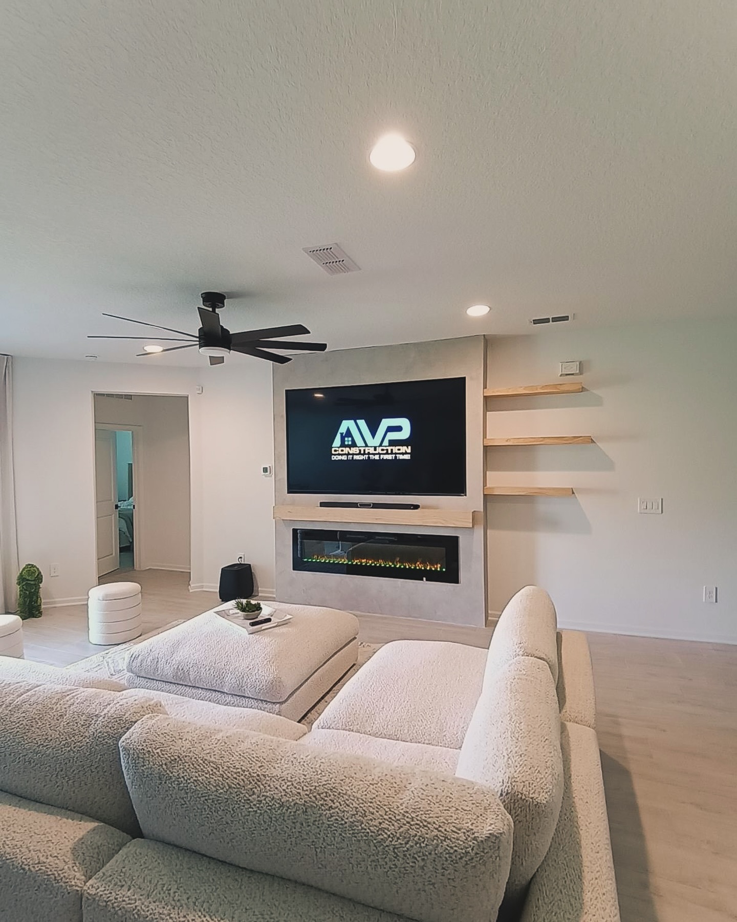 Custom living-room media wall with paneling by AVP Construction JAX — Jacksonville & St. John's County, FL