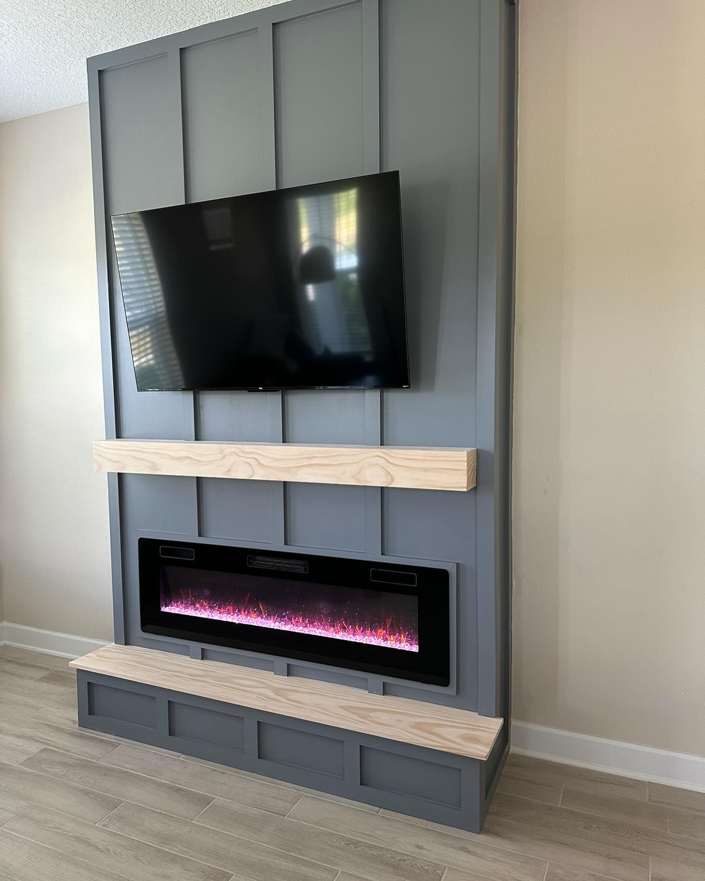 Floor-to-ceiling media wall with custom millwork by AVP Construction JAX — Jacksonville & St. John's County, FL
