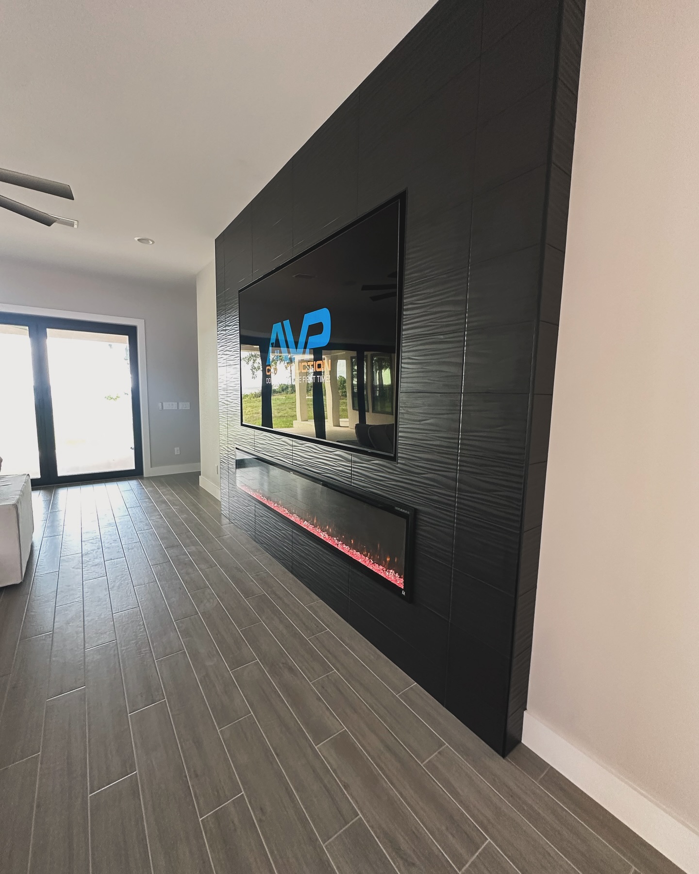 Slat-wall TV feature with hidden wiring by AVP Construction JAX — Jacksonville & St. John's County, FL
