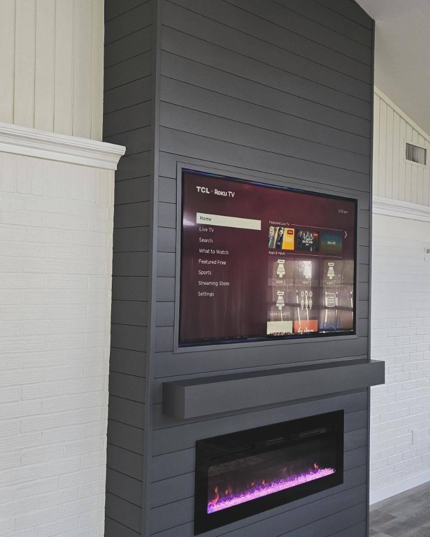 Floor-to-ceiling media wall with custom millwork by AVP Construction JAX — Jacksonville & St. John's County, FL