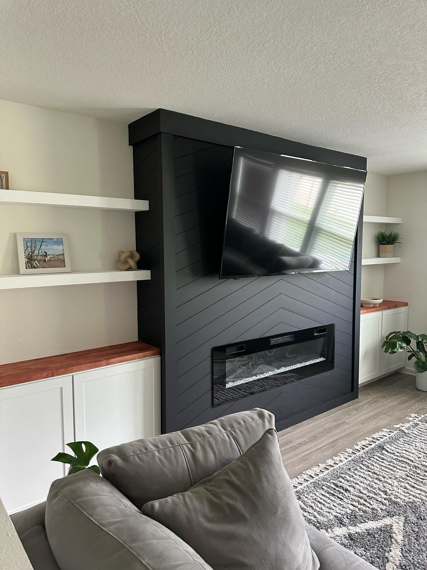 Built-in TV cabinet flanked by display shelving by AVP Construction JAX — Jacksonville & St. John's County, FL