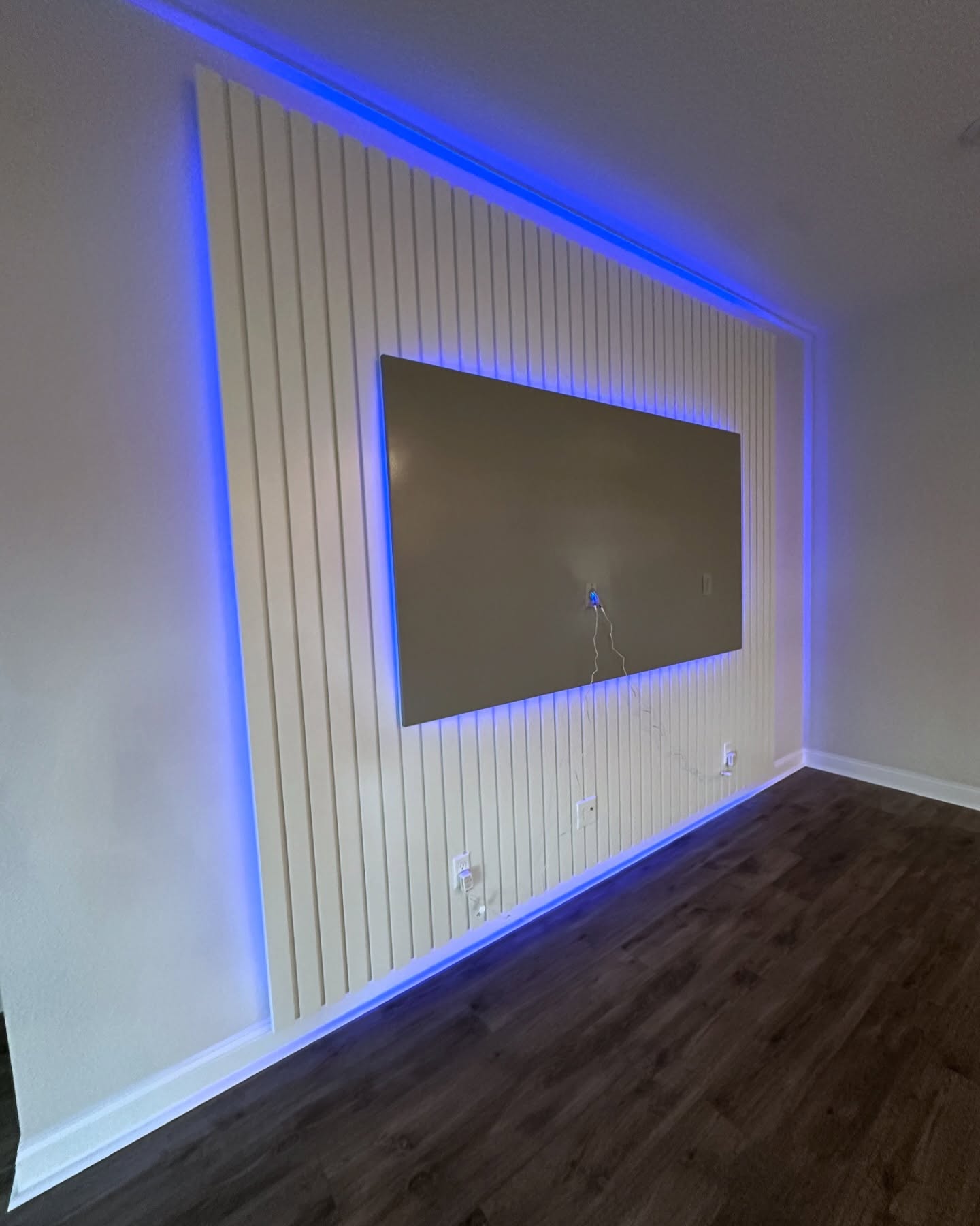 Slat-wall TV feature with hidden wiring by AVP Construction JAX — Jacksonville & St. John's County, FL