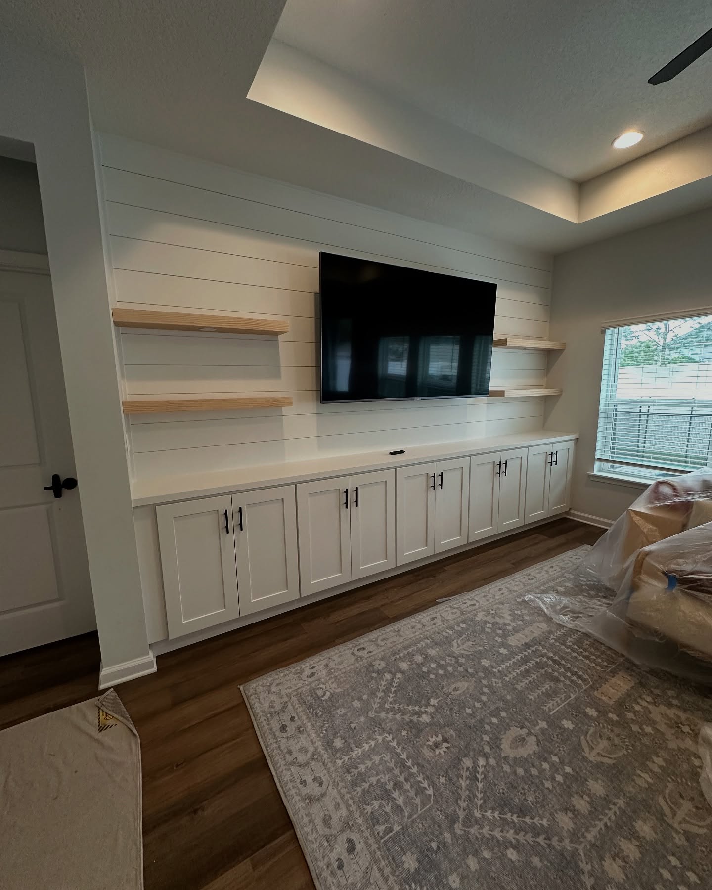 Custom TV entertainment center built-in by AVP Construction JAX — Jacksonville & St. John's County, FL