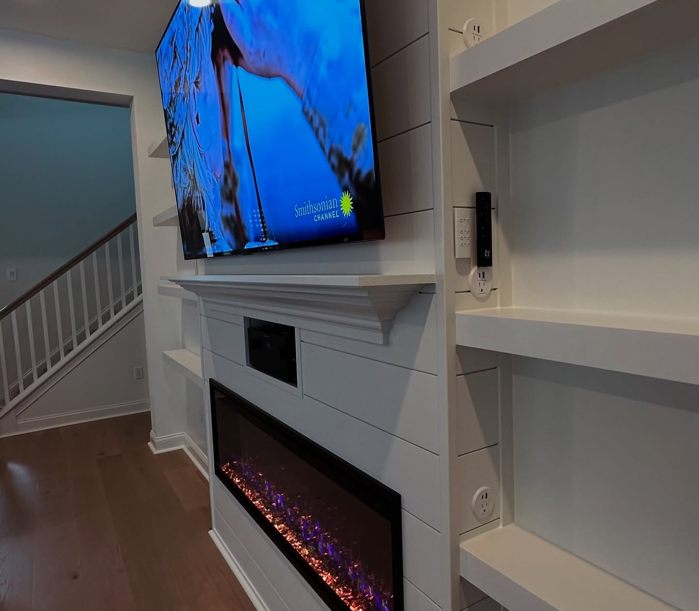 Wall-mounted TV with under-cabinet storage by AVP Construction JAX — Jacksonville & St. John's County, FL