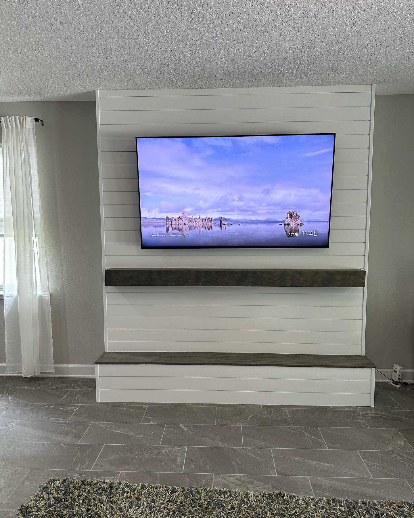 Floating-shelf TV built-in with shaker cabinets by AVP Construction JAX — Jacksonville & St. John's County, FL