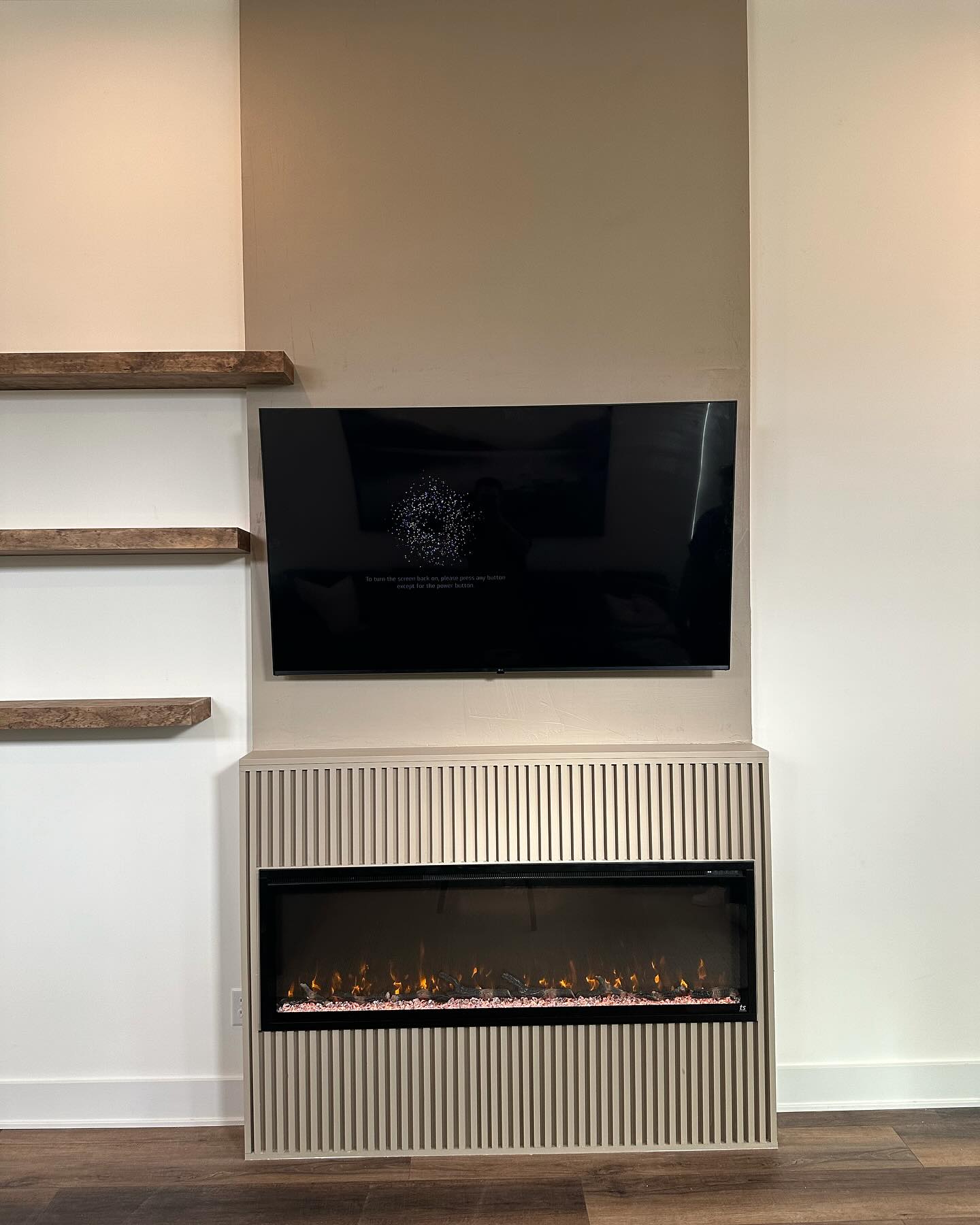 Wall-mounted TV with under-cabinet storage by AVP Construction JAX — Jacksonville & St. John's County, FL