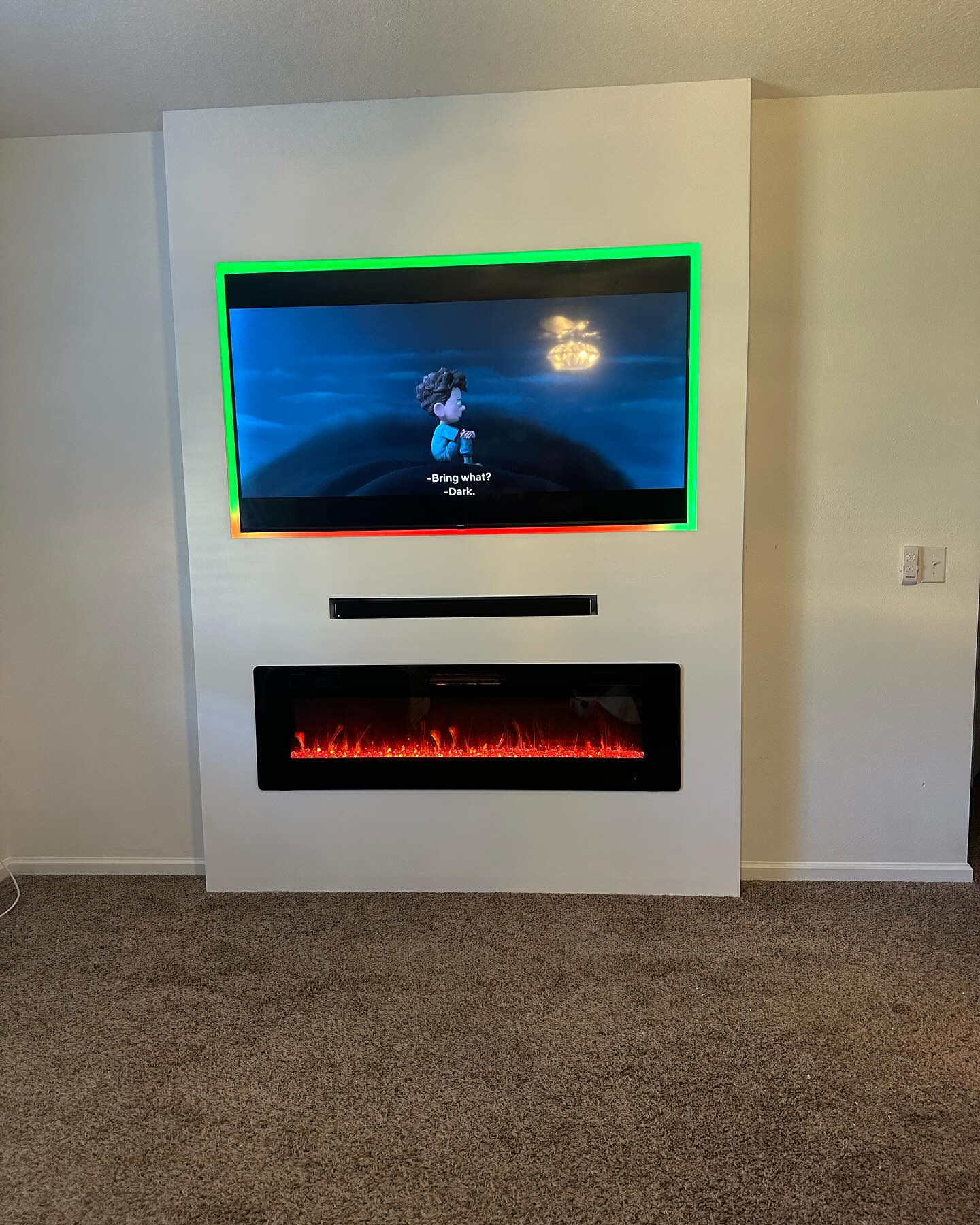 Built-in TV cabinet flanked by display shelving by AVP Construction JAX — Jacksonville & St. John's County, FL